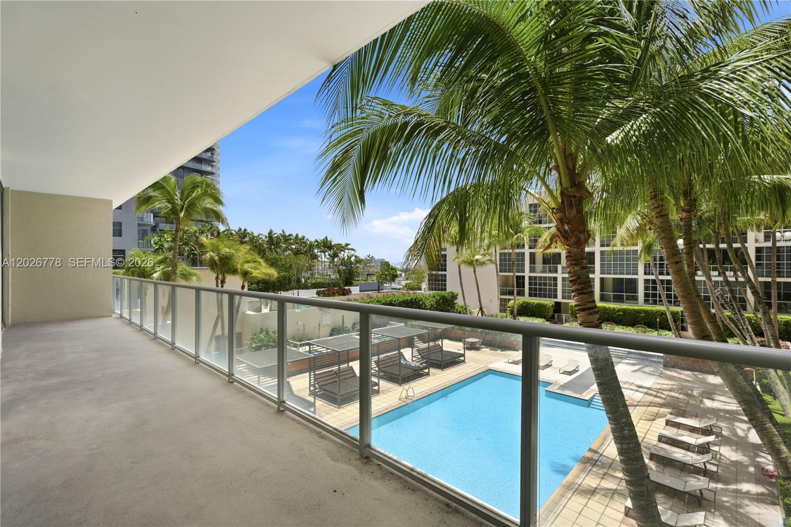 Sophisticated living meets ultimate convenience in this stunning residence, featuring a thoughtful split-floor plan with two spacious master suites, ten-foot ceilings, and an open-concept kitchen finished with premium granite countertops. Refined laminated wood flooring flows throughout the home, leading to floor-to-ceiling impact windows that offer serene pool views and seamless access to the outdoors. This residence is elevated by modern upgrades, including remodeled bathrooms, a refreshed laundry area, keyless entry, and motorized blinds, with the master suite further enhanced by a personal safe and the kitchen and laundry boasting all-new appliances throughout. Beyond the walls of this refined unit, you will enjoy a full suite of resort-style amenities, two dedicated bicycle storage spaces, and a premier location that puts Midtown shopping and the Design District at your doorstep, with effortless transit to Wynwood, Miami Beach, and the international airport.