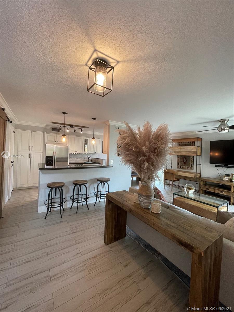 Fully Renovated, sparkling clean townhouse located on a quiet street in Palmetto Bay. Open plan living room, kitchen, dining, and half bathroom are on the ground level; spacious 2 bedrooms and full bathroom on a second level. Walk-in closet has convenient built-ins in Master bedroom with small loft above it. New hurricane Impact windows and doors, private patio, wine cooler, instant water heater, granite countertops, spacious pantry, eat-in kitchen. Near The Falls Mall, LA fitness just a moment away.  Easy access to US1 and Turnpike.