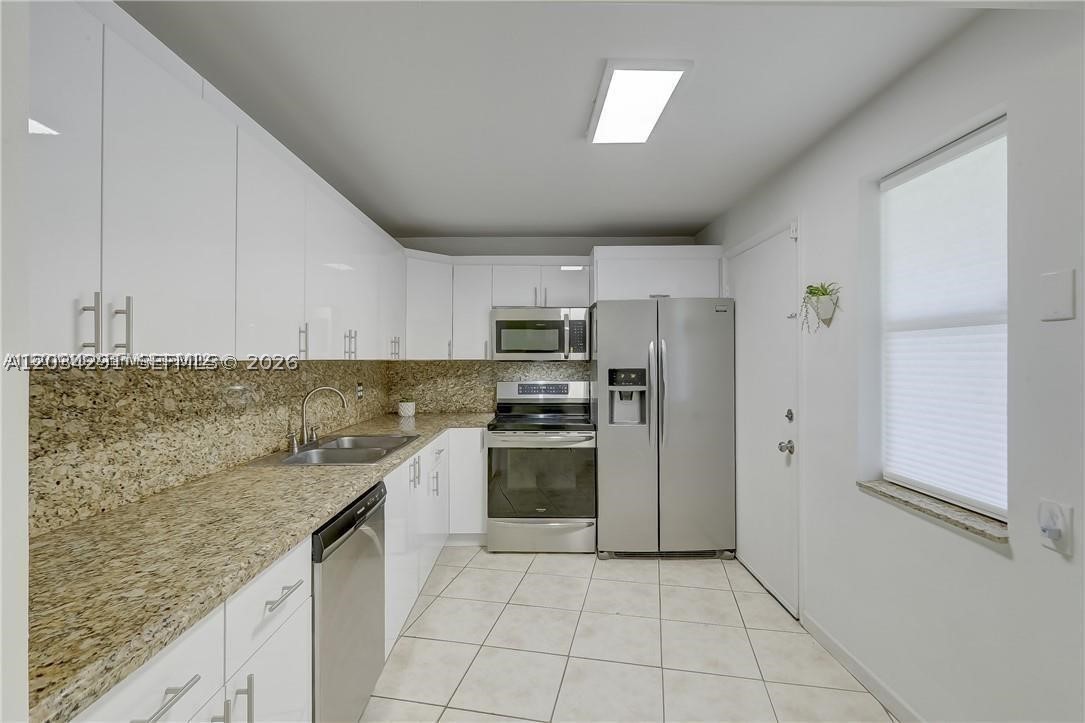 Beautifully updated and spacious 2-bedroom, 2-bath residence offering an open-concept layout with abundant natural light and expansive living areas. The modern kitchen features sleek white cabinetry, granite countertops, stainless steel appliances, and ample storage space. Neutral tile flooring runs throughout the home, creating a clean and cohesive look that is both stylish and low maintenance.

The oversized primary suite offers generous closet space and large windows that fill the room with natural light. Enjoy a bright and airy living and dining area that seamlessly extends to a spacious screened patio overlooking a private green space, providing the perfect setting for morning coffee, entertaining, or relaxing outdoors year-round.

Additional features include updated lighting, ceiling fans, plentiful storage, and assigned parking. Conveniently located near major highways, Aventura Mall, shopping, dining, parks, beaches, and both Miami-Dade and Broward County destinations. Well-maintained community with easy access to everyday conveniences.

Move-in ready for the 1st of July and offering exceptional value in a highly desirable location. A must-see opportunity!