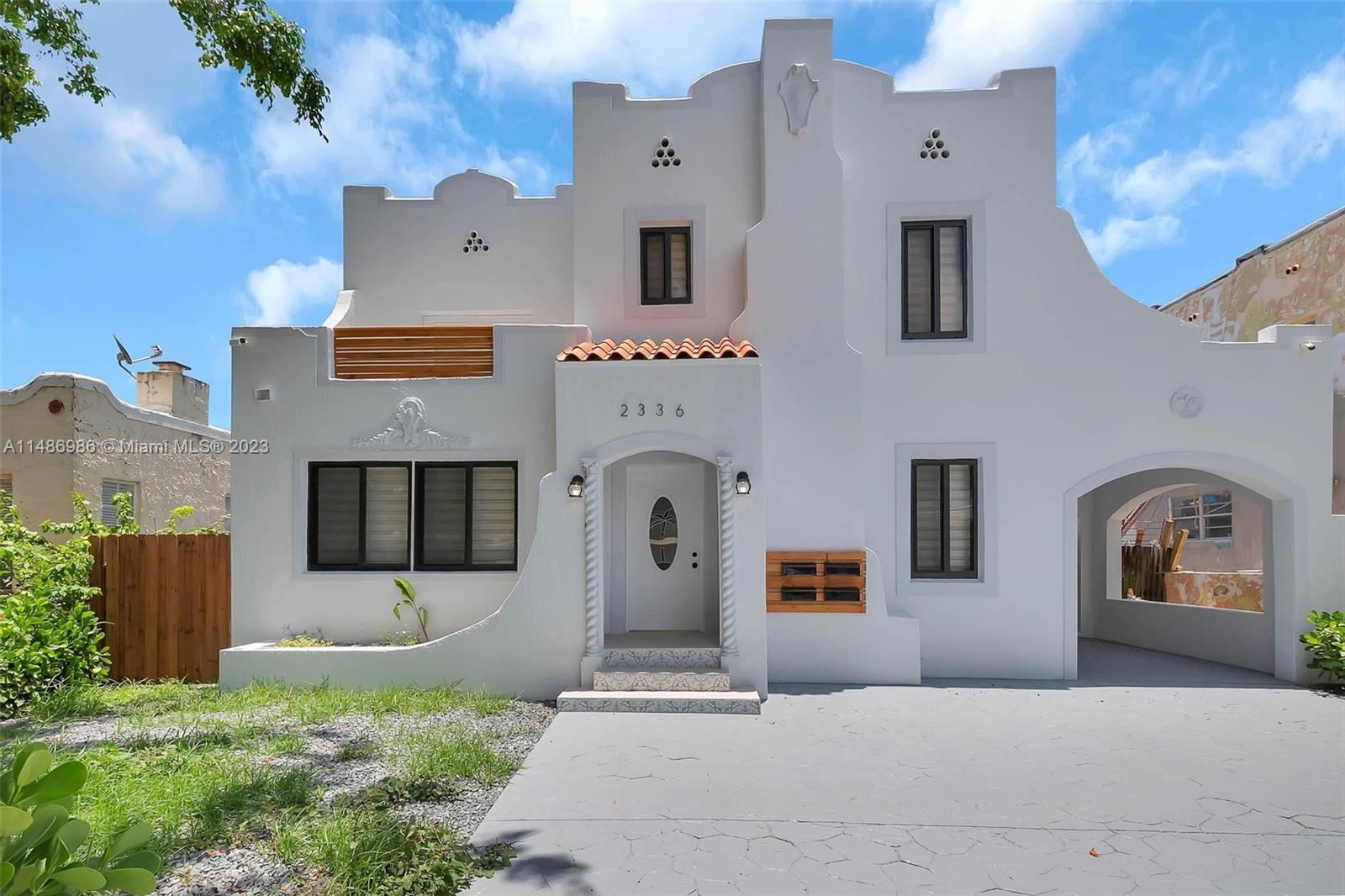 Discover this renovated Old Spanish gem in Shenandoah. This 4-bedroom, 2-bath home blends historic charm with modern updates. Charm exudes with updated baths, wood flooring, and impact windows throughout. The kitchen features new cabinetry, stainless steel appliances, and granite countertops. Four bedrooms and one bath upstairs, along with a den/office and second bath downstairs. Enjoy the original fireplace, formal dining, indoor laundry, and the added convenience of a paved patio, driveway, and covered carport. Rent includes water — seamless living awaits!
