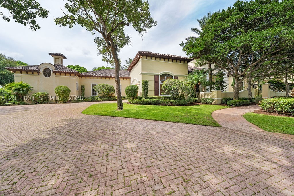 Welcome to 9001 SW 59th Ct, a rare offering in the heart of Pinecrest. This is the largest 1 story residence for sale in all of Miami Dade county w/ 9223 Sq ft living area. Superb location, nestled on a sprawling 1.25 acre pie-shaped lot on a cul-de-sac w/ double gated entry. The split floor plan has been designed flawlessly for grand entertaining & comfortable family living w/ the west wing belonging to the Owner’s suite, owner’s garage, office, plus 2 flex rooms for gym, wellness, media, nursery, game room.  Lots of natural light in the marvelous entrance w/ 20+ ft ceilings, all impact windows & doors, formal dining, gourmet chef’s kitchen w/ breakfast area, wine cellar, pantries, great room. The center wing has its own family room + 3 ensuite bedrooms.  The east wing has 3 additional ensuite bedrooms, maid quarters, laundry room, & 2nd garage. The resort style grounds and mature landscaping & trees create a private oasis with plenty of outdoor entertainment options like a large covered terrace w/ summer kitchen w/ ample dining and seating space, basketball/pickleball court, a sparkling pool, plenty of green space around this residence. Built in 2004 & meticulously maintained, this extraordinary estate  embodies luxury living, timeless architecture & exceptional craftsmanship in one of South Florida’s most coveted neighborhoods, moments from top-rated schools, find dining, luxury shopping. A timeless estate. An unparalleled setting. A legacy property.