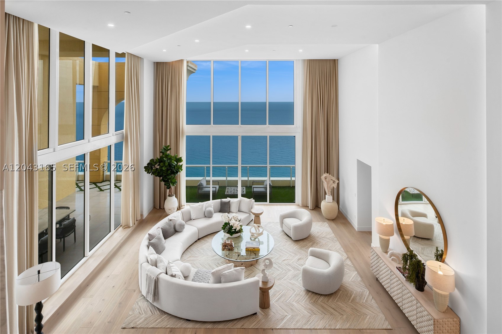 Spanning over 8,081 SF of impeccably designed living space, Penthouse 5002 is a never-lived-in architectural masterpiece by renowned designer David Arcadian, where timeless elegance meets exceptional craftsmanship. A dramatic 26-foot double-height great room anchors the residence, complemented by two lavish primary suites with oversized custom closets, spacious guest bedrooms, a laundry chute, and a private detached guest house. The rooftop pool crowns this palace in the sky. Located at Acqualina Resort & Residences, residents enjoy a world-class five-star lifestyle with 24-hour room service, award-winning Il Mulino and Ke-uH restaurants, an oceanfront spa, concierge, valet, and exceptional resort amenities.