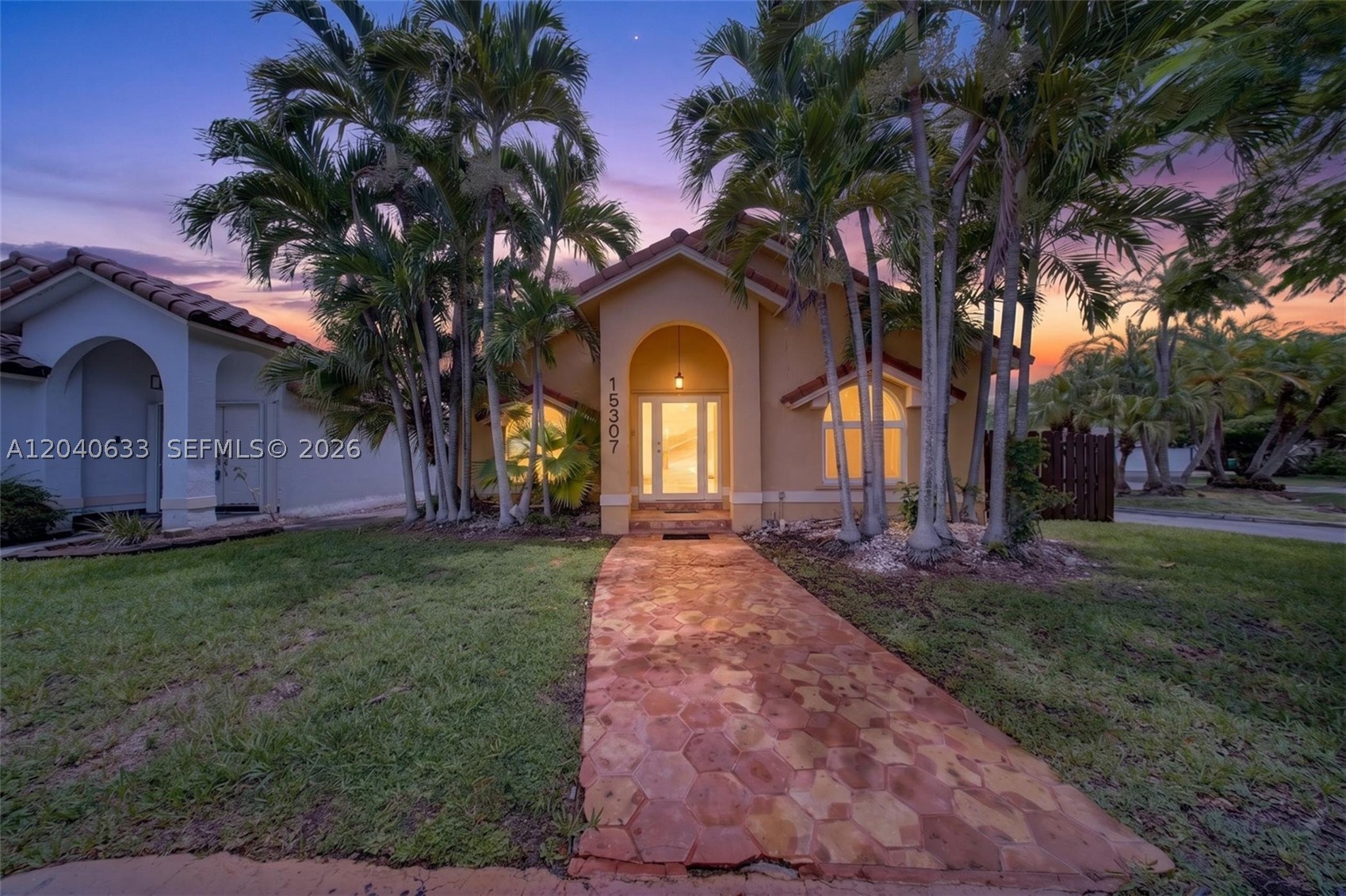 Beautifully remodeled 2-bedroom, 2-bath corner single-family home offering breathtaking direct lake views. This bright and inviting residence features an open-concept floor plan, soaring ceilings, abundant natural light, and ceramic tile flooring throughout. The updated kitchen is equipped with elegant quartz countertops, while the renovated bathrooms provide a modern, upscale feel. No Association Approval Required – move-in ready! Both bedrooms are generously sized and include sitting areas. The primary bathroom features a Roman tub, separate shower, and bidet. Step outside to enjoy a private patio with mature shade trees, pavers, green space, and a covered porch, perfect for relaxing or entertaining. The extended driveway provides parking for up to four vehicles, and the lush landscaping adds exceptional curb appeal. Located in the highly desirable Lakes of the Meadow community, this home offers comfort, tranquility, and beautiful waterfront living. A must-see!