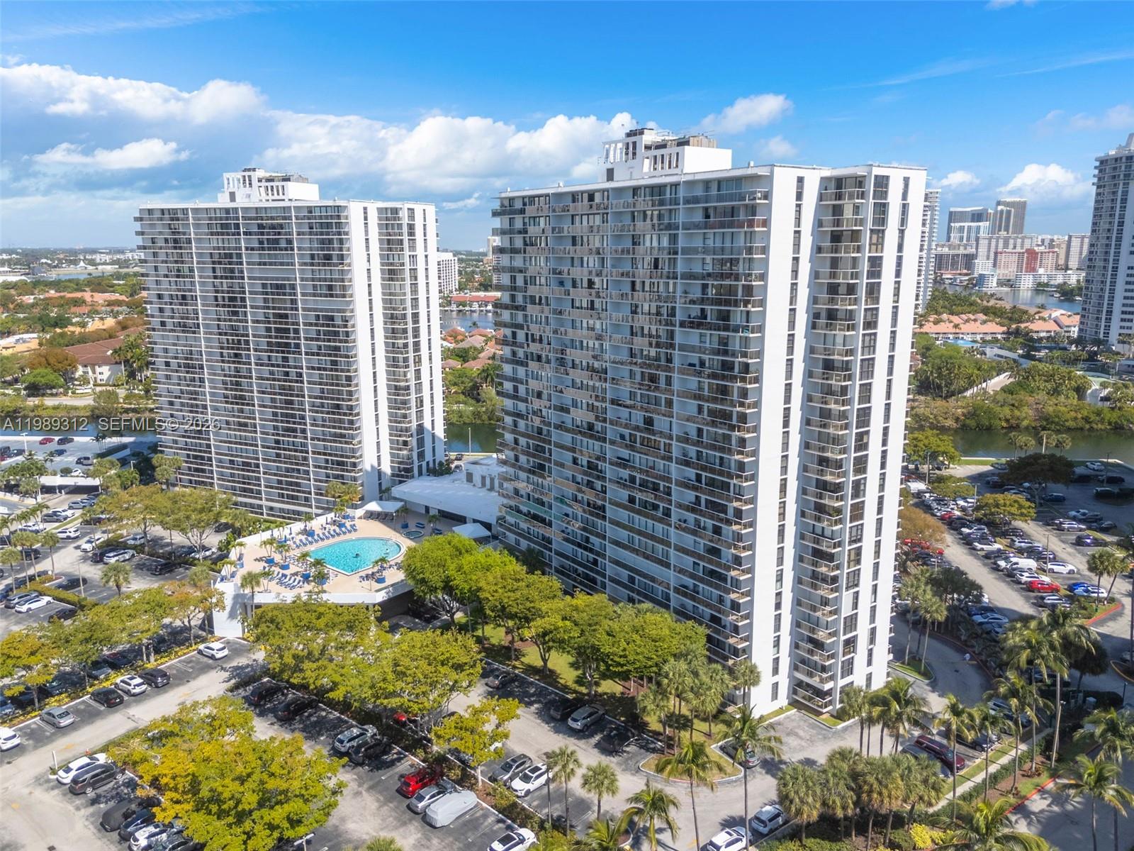 Stunning legal 3-bedroom, 3-bath residence offering 1,465 SF in the heart of Aventura. Converted as a 2 bedroom - 3 bath this spacious unit features a bright, open-concept layout with floor-to-ceiling windows showcasing water, Turnberry Isle Country Club Golf course, and skyline views of Aventura & Sunny Isles.

The kitchen features modern white cabinetry, quartz countertops, & stainless steel appliances, seamlessly flowing into the living & dining areas—perfect for entertaining. Recent renovations includes full painting, new light fixture, automatic blinds in the living room, and manual black out in the bedrooms, new custom cabinets & quartz stone in the living room as well as a wet bar by the dining area. The expansive primary suite includes a walk-in closet and direct access to the balcony, while all bedrooms offer ample space and natural light.

Enjoy living just minutes from Aventura Mall, Gulfstream Park, and the beaches of Sunny Isles Beach. Conveniently located near top-rated schools, dining, shopping, and major highways.

Sold fully furnished with quality modern furniture and appliances - this is South Florida living at its finest waiting for you. 

Building has completed all of it renovations: common areas, pool, gym, facade, impact balconies, seawall, elevators, and lobby. Assessment will be paid in full at closing.