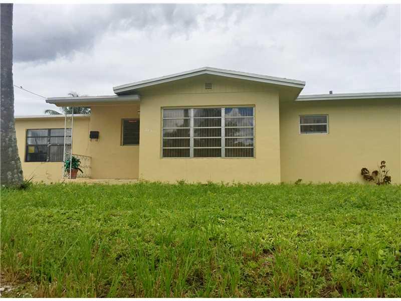 Great opportunity for investors or your own home!! Split bedroom layout allowed for Master Bedroom to be completely separated with its own entrance, additional kitchen, and living room. It is perfect for an additional source of income! Wood floors in the  bedrooms. The extensive backyard includes amazing fruit trees, like mangoes, bananas & avocados. Easy acces to I-95, minutes to Fort Luaderdale beach and the airport.