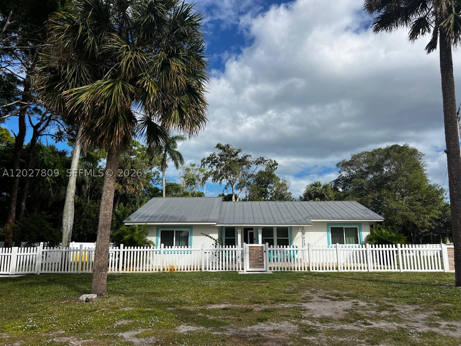 Nestled on a private half-acre lot backing to the Audubon of Martin County Nature Preserve, this fully renovated property offers a unique blend of privacy, flexibility, and location. The main residence features 3 bedrooms, 2 updated bathrooms, a spacious living room, dining area, Florida room, and an eat-in kitchen with abundant cabinetry and counter space. The primary suite includes a large ensuite bath with dual sinks and a walk-in shower. A rare downstairs 1-bedroom, 1-bath guest quarters with its own kitchen provides additional living space for guests, extended family, multi-generational living, or potential rental income. Outside, enjoy a private inground pool surrounded by tropical landscaping, expansive patio areas, and peaceful preserve views. The fully fenced property offers room to relax, entertain, and enjoy the outdoors while maintaining a sense of privacy rarely found this close to town. Conveniently located between Downtown Stuart and Hutchinson Island, you'll be just minutes from beaches, boating, waterfront dining, shopping, and all that the Treasure Coast lifestyle has to offer.