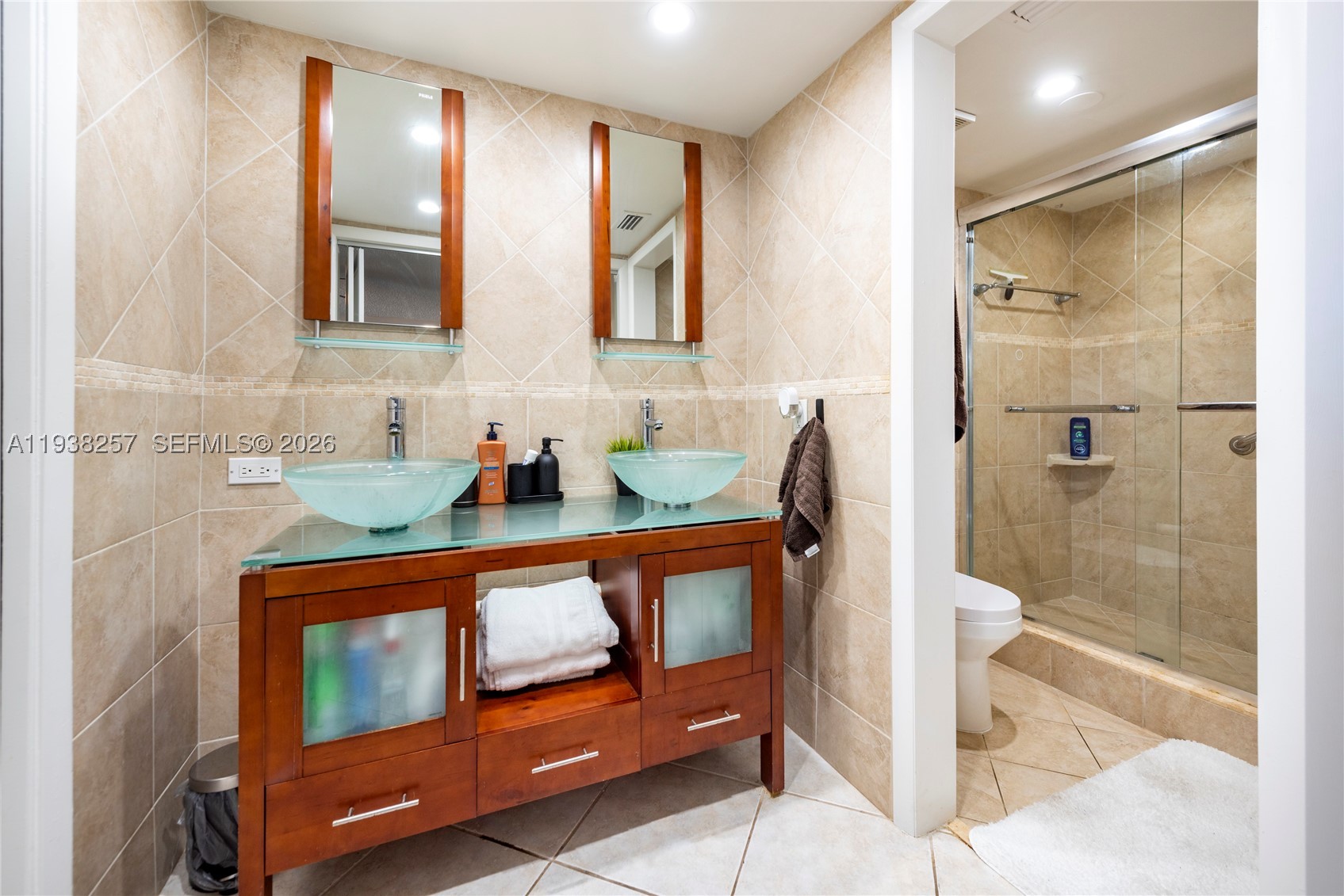 HUGE PRICE REDUCTION!!!!MOTIVATED SELLER !!!!Beautifully furnished, TURN KEY spacious 2/2 offers over 1270 sq ft of living space. LARGEST CONDO IN THE COMMUNITY. Located in the highly sought after community of Lakes of Carriage Hills. Bright & open impeccably kept. UPDTED THROUGHOUT. Two large bedrooms with spacious walk in closets, large separate laundry room with full size washer & dryer. Enjoy strolls on the walking paths & bridges throughout this maintained 55+ community. Tiled screened porch. ASSESSMENTS HAVE BEEN PAID - Clubhouse activities, 2 heated pools, tennis courts, shuffleboard &n much more just steps from your front door.
