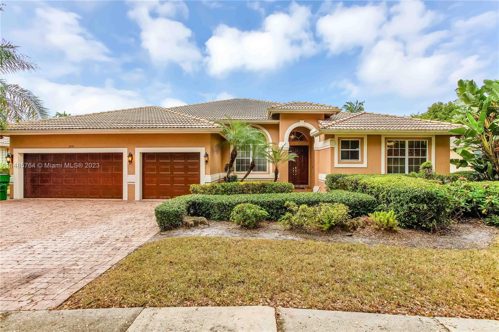 This stunning property features high ceilings, split floorplan, 4 bedrooms + an office, plantation shutters & 2 a/c units. Large windows invite an influx of natural light that amplifies the sense of space, casting a natural glow upon the high ceilings & beautiful travertine tiled flooring adding to the grandeur of the home. The kitchen is well appointed, designed with modern ss appliances, including a double wall oven, an island & a convenient butler’s pantry makes preparing meals a delightful experience. The inclusion of an eat-in counter & eat-in kitchen provide ample room to enjoy meals. The exquisite primary suite boasts a tray ceiling, a walk-in closet, a 2nd closet, wooden flooring, & en-suite bathroom w/2 sinks, walk-in shower & soaker tub ensuring total repose after a long day.