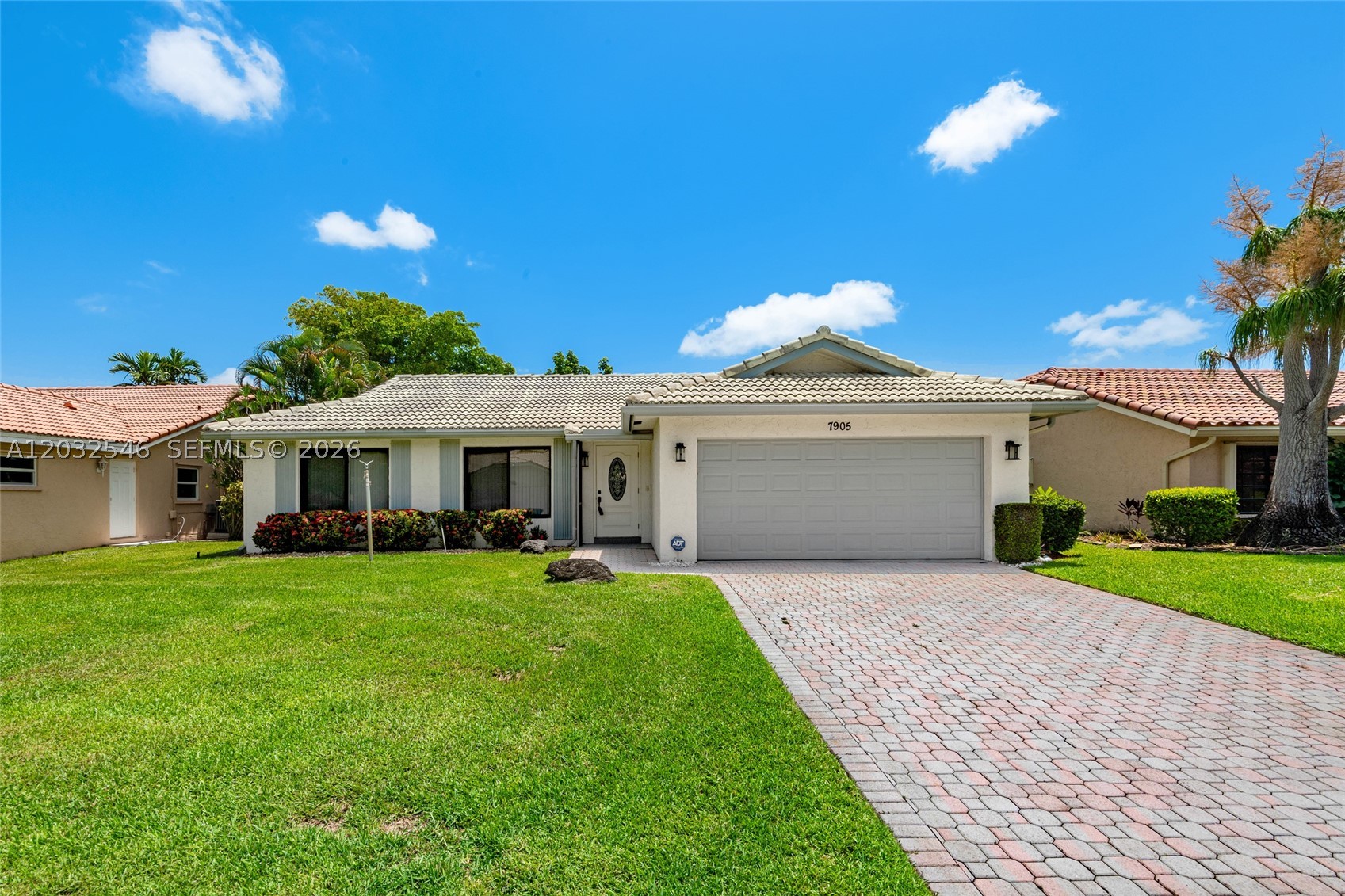 Spacious 2-bedroom, 2-bath single-family home located in the highly desirable Cloverfield Community (55+) at Boca Del Mar, in Central Boca.  This well-maintained home features a 2-car garage, new hurricane windows and sliding glass door leading to an enclosed covered patio that overlooks the backyard, and an interior laundry room.  The home boasts a seamless flow, offering large open living spaces enhanced by vaulted ceilings and an abundance of natural light.  The spacious primary suite includes a walk-in closet, an ensuite bath with dual sinks and a step-in shower with a recently installed water-stain resistant glass shower enclosure. Cloverfield is known for its low HOA fees and exceptional maintenance program that includes lawn care, basic cable, exterior house painting, and scheduled roof cleanings. There is a heated community pool, clubhouse, and a welcoming neighborhood atmosphere. Only one owner must be 55+ and pets are welcome with no restrictions. Conveniently located near the grocery stores, medical centers, houses of worship, the Town Center Mall, FAU, Mizner Park, beaches, and major highways. The home offers the perfect blend of comfort, convenience, and active-adult living. Property is being sold as-is. Some images have been virtually staged for illustrative purposes.