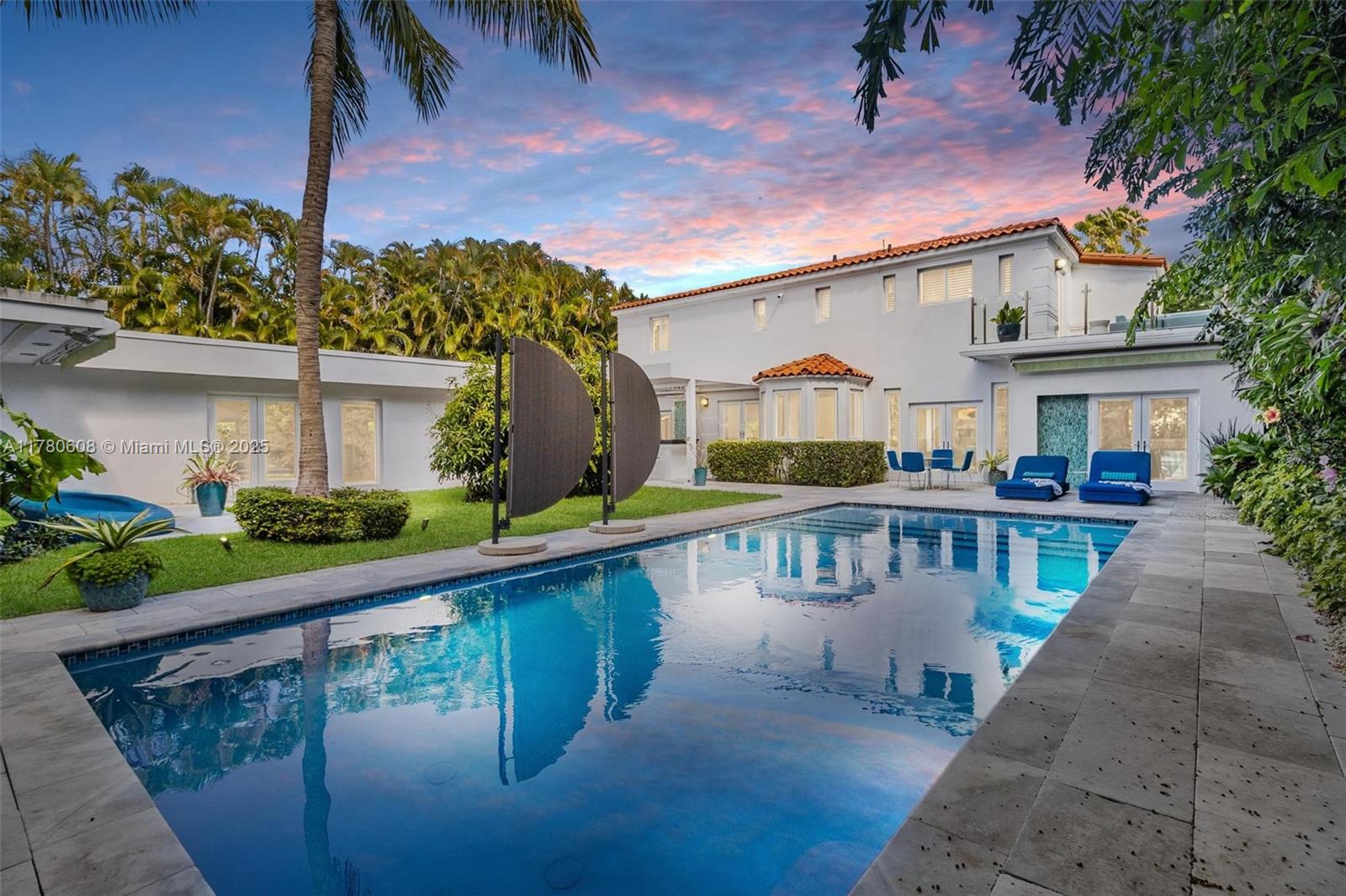 Step into this beautifully remodeled Russell Pancoast art deco gem, located on tranquil Flamingo Drive offered fully furnished & move-in ready. The spacious 4 bd & 4.5 bath home recently updated w/impact glass windows,
Control4 system, new baths, HVAC, & modern chef’s kitchen, offers great living space, breakfast room, formal
dining, media room & office. The beautiful staircase w/ intricate tile design wall will take you to the Master suite w/ opulent bath, 2 walk-in closets & private terrace to sip your morning coffee. An additional 2nd bed w/ ensuite bath is also located on the second level. The lushly secluded backyard is equipped w/a saltwater pool,
summer kitchen, & patios for lounging. Perfectly located near the beach & all that South Beach has to offer. Rare
find! Easy to show
