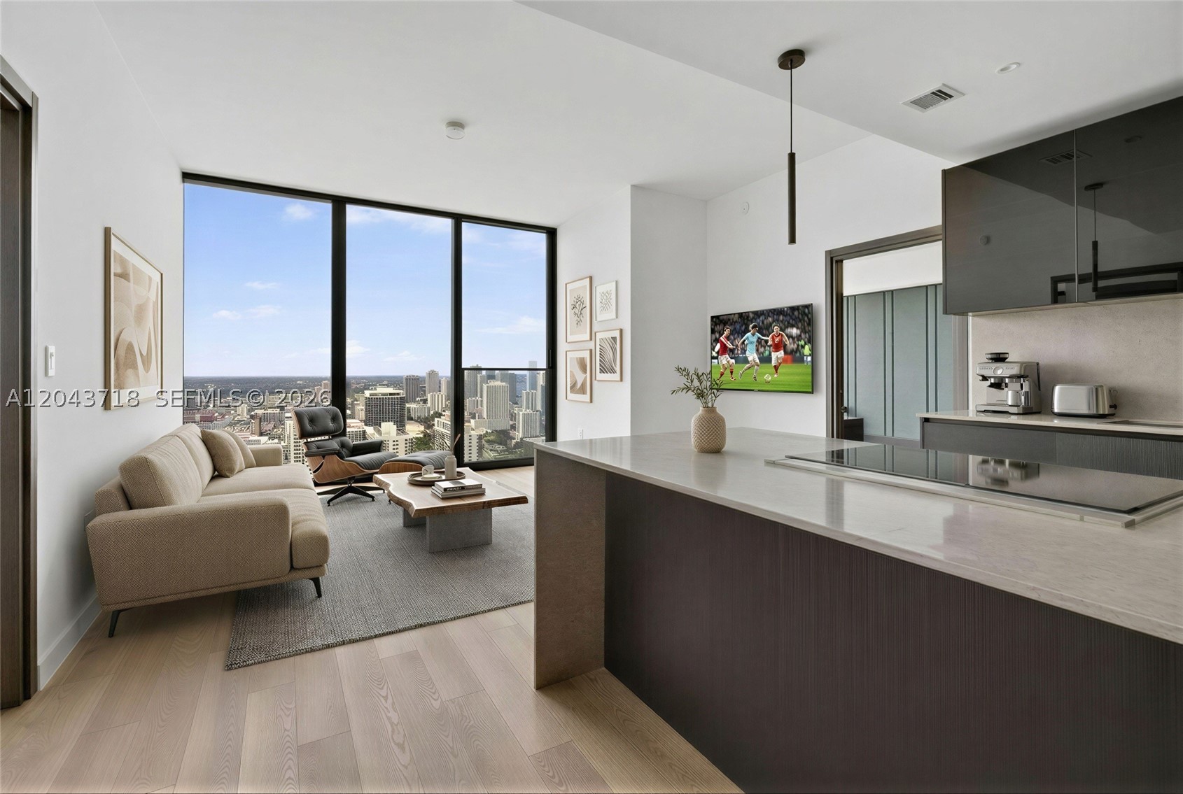 Discover elevated living at E11EVEN Hotel & Residences, where striking architecture meets world-class hospitality in the heart of Downtown Miami. This exceptional 2-bedroom, 2-bath residence offers 1,169 SF of refined living space with floor-to-ceiling windows framing breathtaking skyline views. Designed with contemporary elegance, the home features lux tile flooring, a sleek European-style kitchen with premium integrated appliances, quartz waterfall island, custom cabinetry, spa-inspired marble bathrooms, generous walk-in closet, and an open-concept layout that seamlessly blends style and function. Delivered unfurnished, this residence presents the perfect opportunity to create a personalized luxury retreat. Residents enjoy an unrivaled collection of resort-style amenities, including multiple pools, rooftop owner's lounge, state-of-the-art fitness center, wellness spa, concierge, valet, room service, private beach club access, and world-class dining. Ideally positioned moments from Miami Worldcenter, Brickell, Wynwood, the Design District, Kaseya Center, and Miami Beach, E11EVEN offers an unmatched lifestyle with flexible short-term rental capabilities, making it an exceptional opportunity for both luxury living and investment.