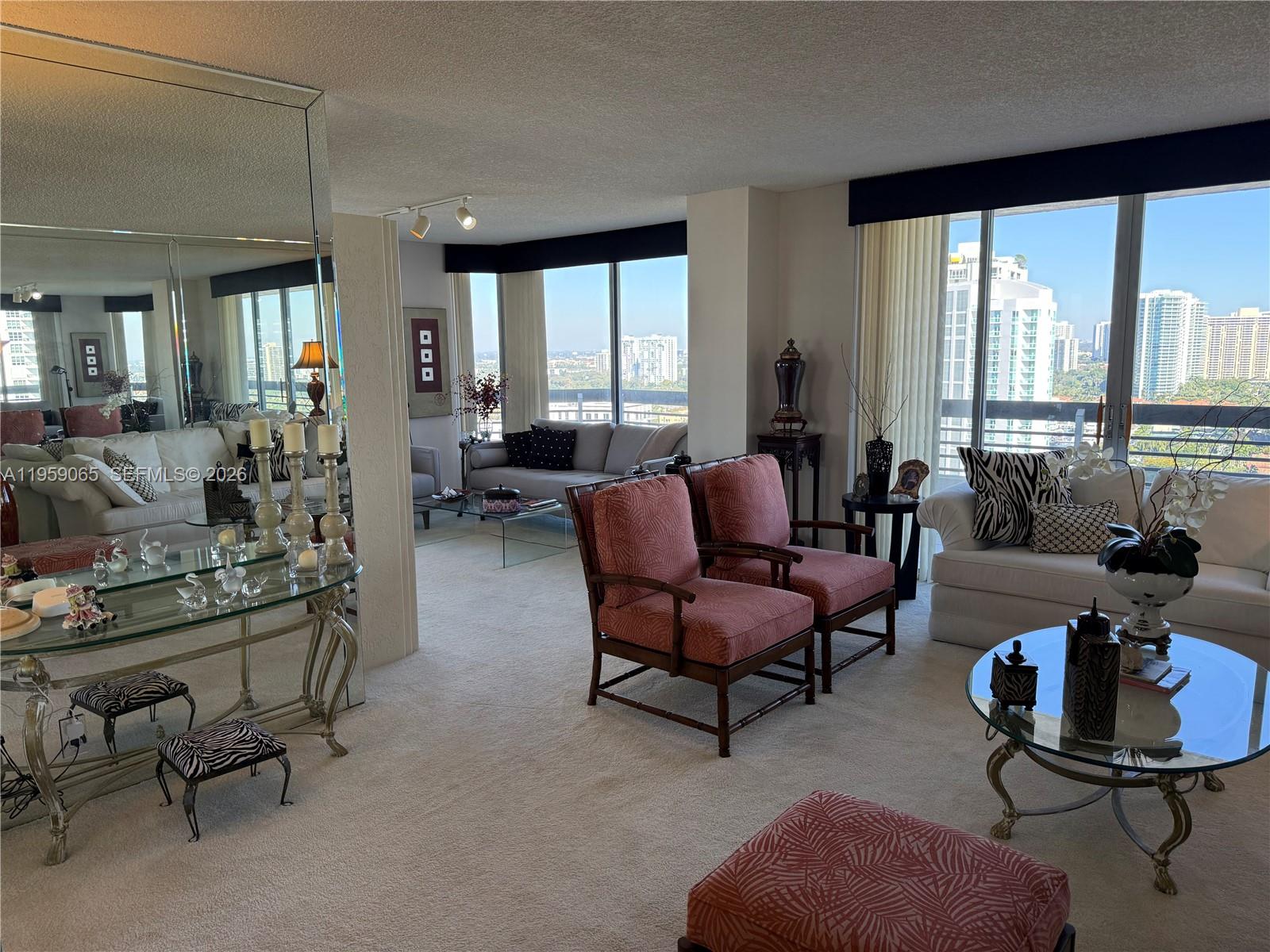 Beautiful 2 bedroom, 2 bathroom unit that has not changed ownership since the building was built.  The layout is a split floor plan with panoramic views of the water and surrounding skyline.  There is a wrap around balcony with floor to ceiling windows.  In unit washer/dryer.  Amenities include a trendy restaurant, tennis/basketball/pickleball courts, sauna, pool, mini mart, and a gym overlooking the water.  Perfectly located near the Aventura Mall, Sunny Isles Beach, and places of worship.  This is an ideal opportunity for comfort and luxury!
