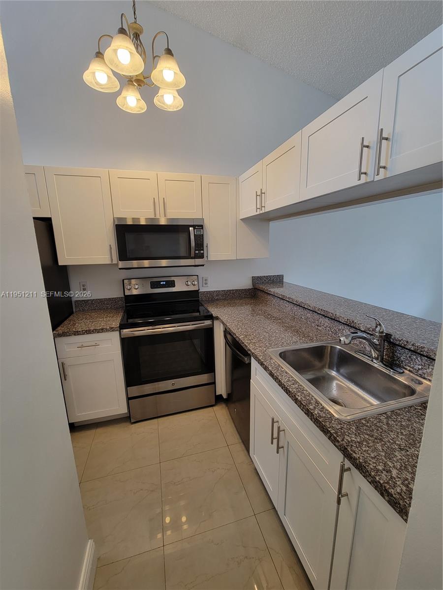 Beautiful 2-Bedroom, 2-Bathroom Condo—PERFECT FOR INVESTOR OPPORTUNITY! TENANT IN PLACE!
No Special Assessments. Located in the highly desirable Napoli Garden Community, this unit features a split floor plan that offers added privacy. The Home boasts a modern kitchen with quartz Countertops and Stainless Steel Appliances, an in-unit Washer and Dryer, and two updated Bathrooms. Enjoy serene, peaceful views from the unit.

Conveniently located near shopping, dining, and top-rated schools. The HOA covers the roof, landscaping, and exterior painting. Community amenities include a pool, clubhouse, jacuzzi, and tennis courts.

Please submit offers with proof of funds and DU approval. Use the As-IS Contract.
24-to 48-hour appointment notice required.