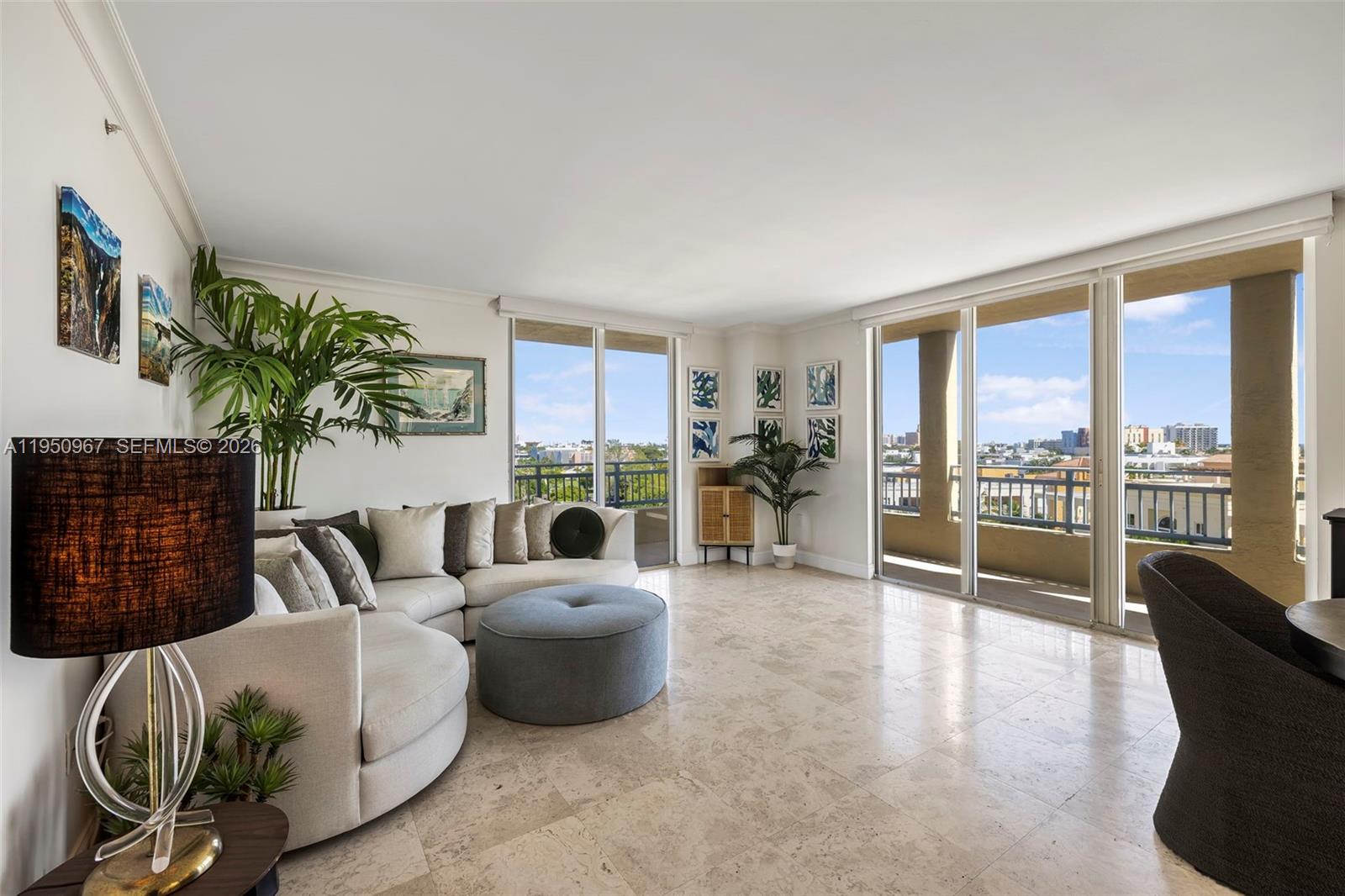 Rare corner residence at The Yacht Club featuring a wraparound balcony with Marina views in the coveted South of Fifth neighborhood. This updated 2-bedroom, 2-bath condo offers 1,130 square feet of light-filled living space with custom closets and built-ins throughout. The building has no current assessments and allows monthly rentals, offering rare flexibility in SoFi. The open layout flows easily for everyday living and entertaining, framed by expansive windows and water views. The Yacht Club is a full-service Marina-front building with outstanding staff, dedicated garage and valet parking, waterfront pool and gym, tennis court, spa, sauna, and barbecue areas, directly on the Marina Walk and steps from South Pointe Park, destination dining, and the beach.