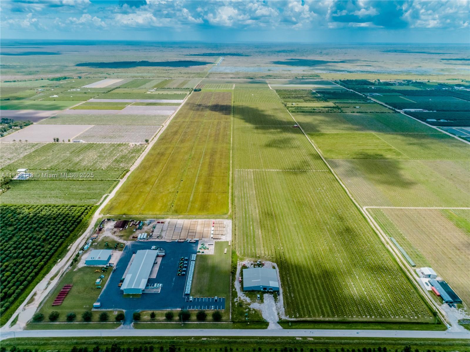 Owner Financing available. 80 Acre farm, fully fenced, gated and irrigated. 12,000 sq. ft. Steel Packing House/Warehouse with office, dimensions are 120ft by 100ft, 6000 sq ft enclosed with 2 loading docks, 6000 sq ft open. 1 diesel pump with irrigation, one drip line irrigation, large walk-in cooler. Most farm equipment and machinery such as 2 tractors, 5 RTV’s, skid steer, and 2 fruit sorting machines included with full price offer. Property has Conservation easement in place Which restricts development.