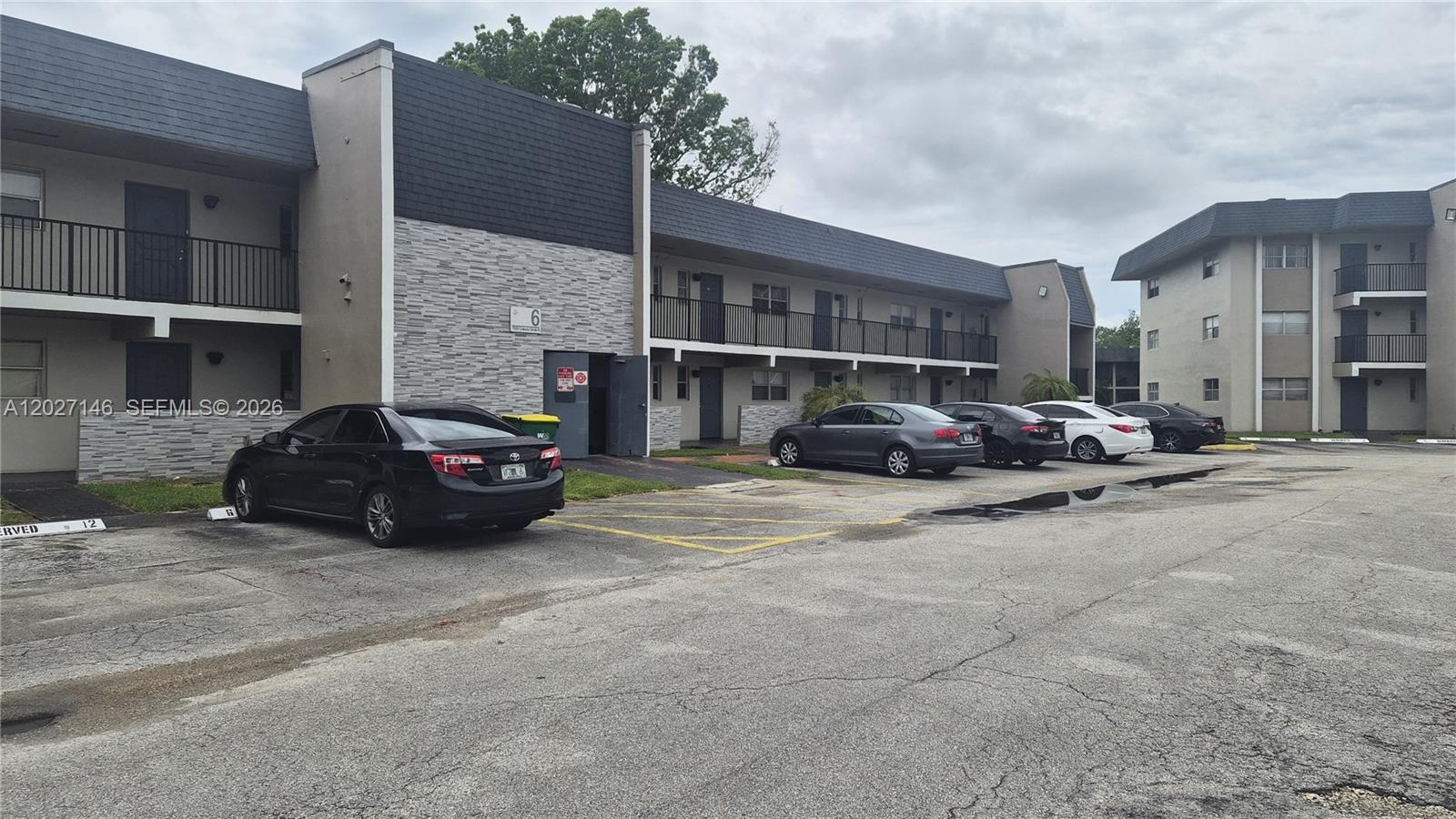 Investor Alert! Turnkey, cash-flowing 1-bedroom, 1.5-bathroom first-floor condo in the desirable Versailles Gardens community. This unit features a serene lake view from your private, enclosed porch, and includes the ultimate convenience of an in-unit washer/dryer. Perfect for a hands-off investor: occupied by an excellent tenant who is eager to stay and sign a new lease. The vibrant community offers top-tier amenities including a swimming pool, tennis, and racquetball courts. Pet-friendly for furry residents under 15 lbs. Don't miss this seamless, income-generating addition to your portfolio!