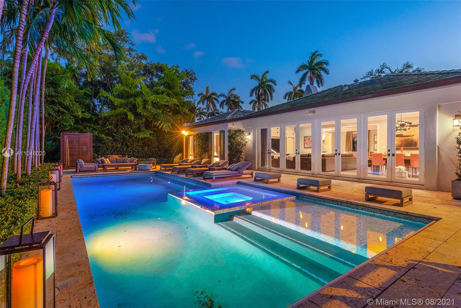 Palm Beach meets Hollywood Regency. Elegant totally renovated designer home, understated elegance, on a 13,125 ft lot on prestigious guard gated La Gorce Island. High 11 ft. ceilings, custom moldings, impact windows, custom cabinetry, double washer/dryer & built-ins throughout. Calacatta gold marble open gas kitchen & baths. Enjoy heated pool w/ jacuzzi, a high end barbecue station/outdoor kitchen, spa, outdoor shower, tropical modern landscaping & very private backyard! “Moderne style” bespoke furniture, classic with a twist of traditional, perfect for entertaining and a Lux lifestyle. 2 car garage, Smart Home, Lutron lighting, Savant system. Stunning in every way!