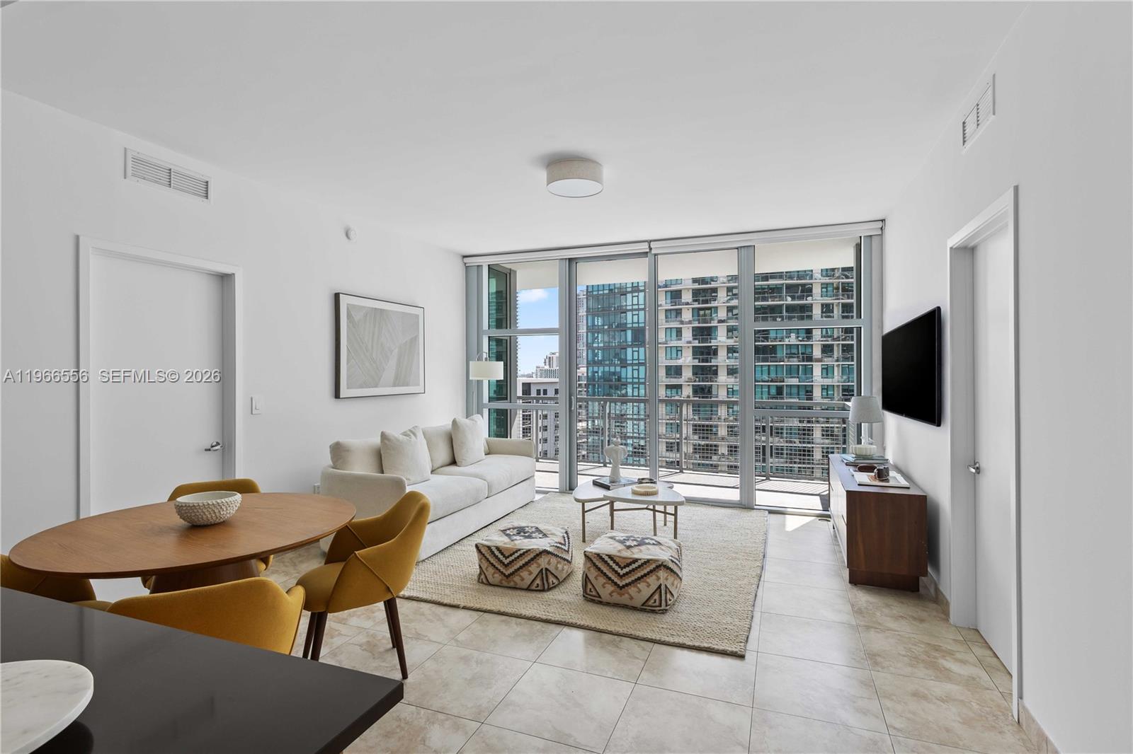 Sophisticated Midtown living awaits in this bright and spacious 2-bedroom, 2-bath residence at 4 Midtown. Facing south, the home is filled with natural light through floor-to-ceiling windows and offers open city views. The open layout features a modern kitchen with premium appliances and flows into the living and dining areas, leading out to a private balcony perfect for morning coffee or evening relaxation. A split-bedroom layout provides privacy, along with generous closet space and well-maintained bathrooms that are both functional and spacious. Residents enjoy a resort-style pool deck, fitness center, sauna, and 24-hour attended lobby. Perfectly located just steps from Trader Joe’s, Whole Foods Market, the Miami Design District, and Wynwood; plus minutes to Miami Beach and Miami International Airport.