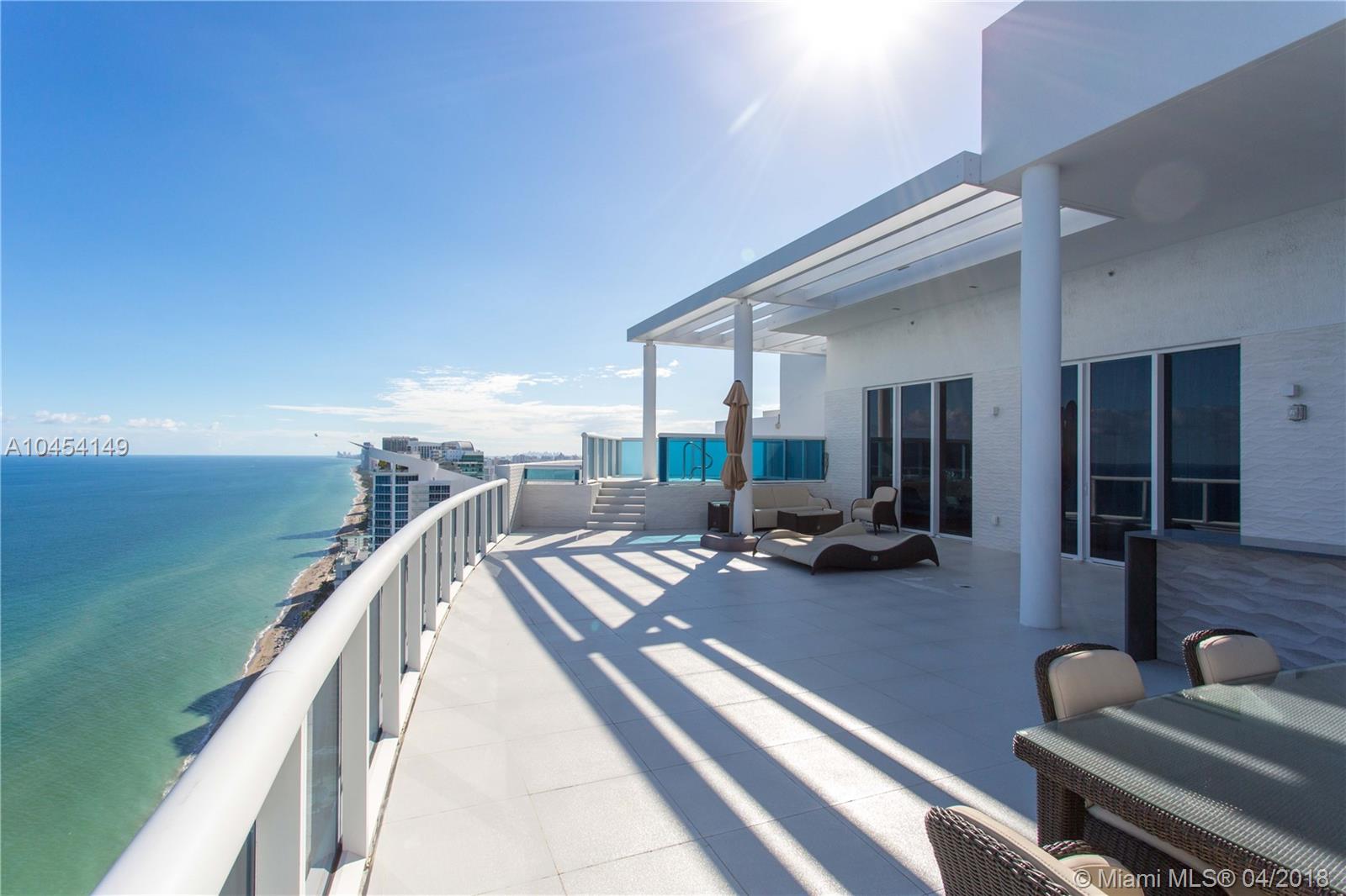 Breathtaking oceanfront 2-story PH is a unique trophy South Florida estate in exclusive Trump Hollywood, settled on 270 feet of pristine white sand. Enjoy panoramic views of the Atlantic, Intracoastal and city skyline from 12' floor-to-ceiling impact proof windows and wrap-around terraces. Home is professionally decorated and furnished by luxury car company Lamborghini.  The custom kitchen offers designer appliances, including temperature-controlled wine storage and a Miele espresso machine. Perfect for entertaining, this residence features an elegant dining room with seating for 12 or more, a media room, family room and library all with ocean or Intracoastal views. 2 floors of living space, 7 Bedrooms, 8.5 Bathrooms, Interior: 9,000 Sq.Ft./Exterior: 3,000 Sq.Ft.