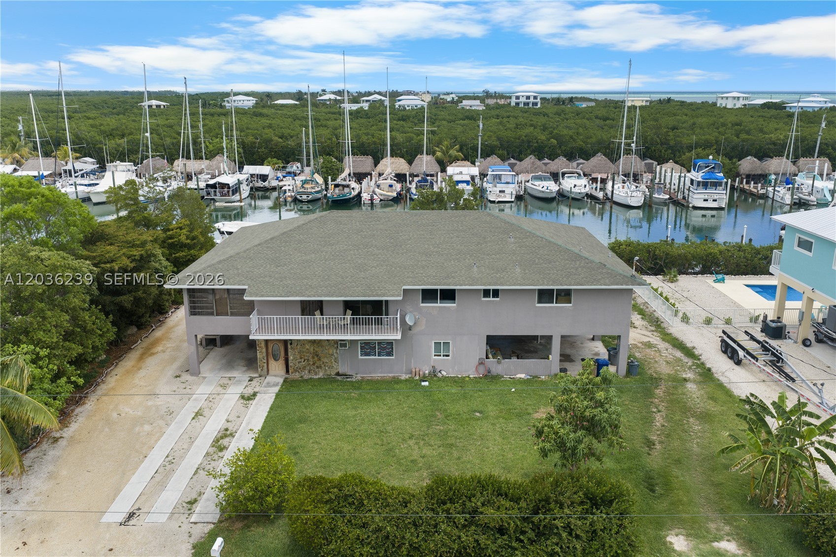 Set within Coco Plum area of Marathon, this waterfront residence presents a rare opportunity to own a premier canal-front property in the Florida Keys. Offering direct boating access to open water, this home embodies the ultimate island lifestyle for the avid boater and coastal enthusiast. The property features a desirable waterfront setting, elevated construction, and an exceptional layout that provides the perfect bones to transform it into your dream home. With endless potential for customization, this residence is ideal for creating a modern coastal retreat or luxury Keys estate tailored to your vision. Located on a quiet, highly sought-after street, it offers both privacy and convenience, just minutes from beaches, dining, and all that Marathon has.