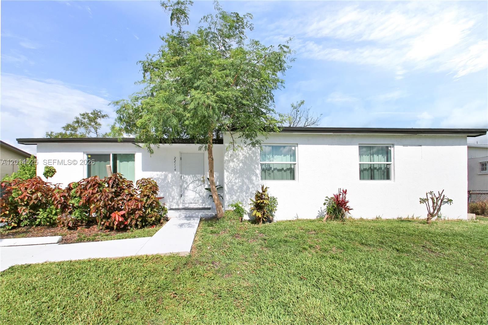 Beautifully remodeled 4-bedroom, 2-bathroom home move-in ready and updated with permits! This bright and modern property features  a brand new A/C system and ductwork ,  stunning new kitchen with a large quartz waterfall island, sleek porcelain floors throughout, and new impact windows and doors for style, comfort, and peace of mind. Spacious open layout ideal for entertaining and everyday living. Enjoy a huge backyard with plenty of room for a pool, RV, boat, outdoor kitchen, or future entertainment area. Conveniently located near major highways, shopping, schools, and more. A perfect opportunity for a primary residence or investment property — easy to show!