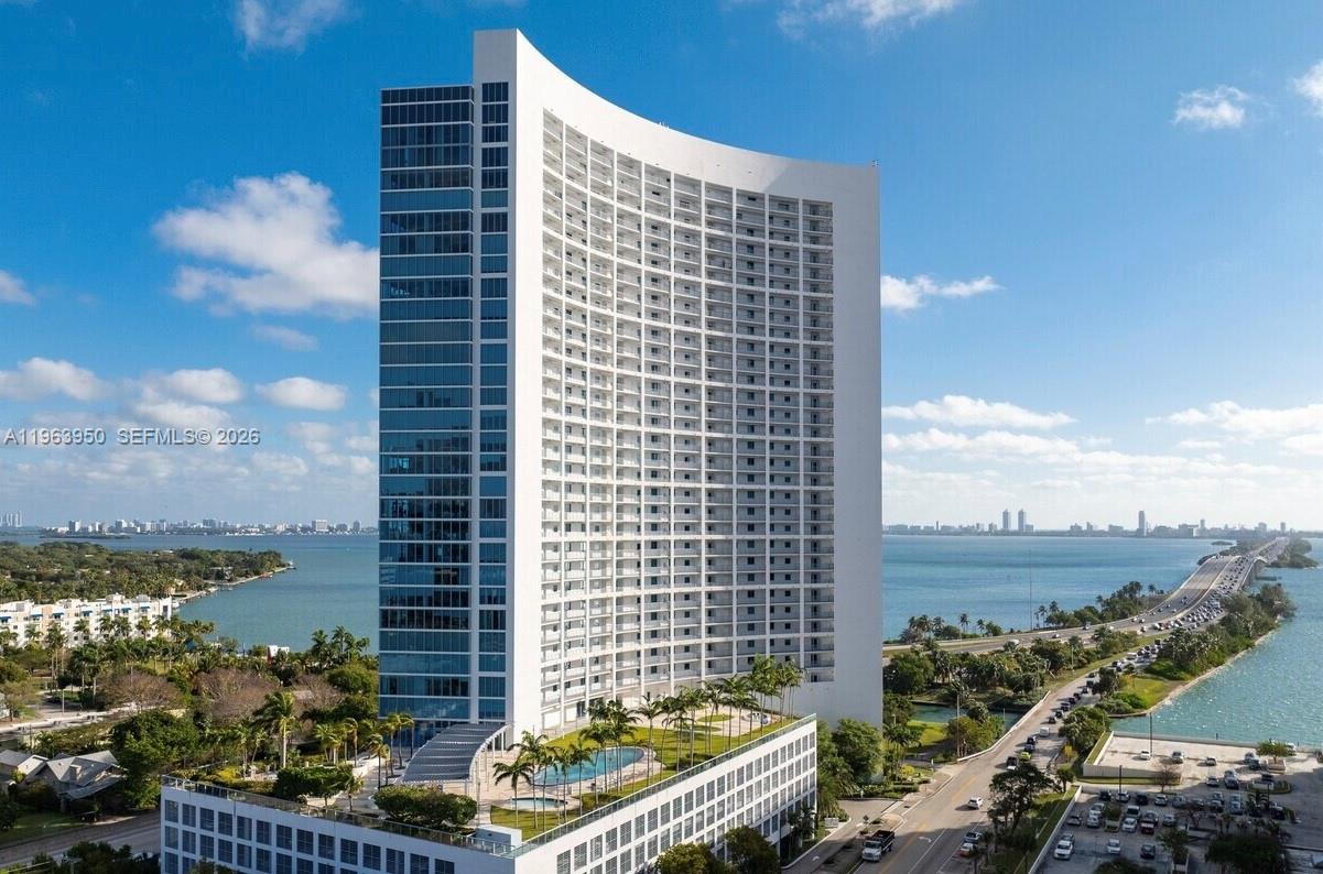 Welcome to high rise luxury living at the Blue Condominium, in the heart of Edgewater, walking distance from Wynwood, Midtown and the Design District. This beautifully designed, High Floor, 2BD/2.5BA offers sweeping bay views and partial city views from the living area and primary bedroom area, enhanced with floor-to-ceiling windows, filling the space with natural light, comfort and style. Marble floors, quartz countertops, S/S appliances, en-suite-bedrooms, remodeled kitchen, new A/C and is impeccably maintained. Resort style amenities include 2 heated pools, gym facilities, sauna, steam, business center, recreation areas, 24/7 security and concierge, valet, BBQ areas, dog park and more. NO ASSESSMENTS, lobby area and elevators to be fully renovated. Easy access to Downtown, Miami Beach and MIA. Don't miss this rare opportunity to own a high floor, bayview residence in Miami.