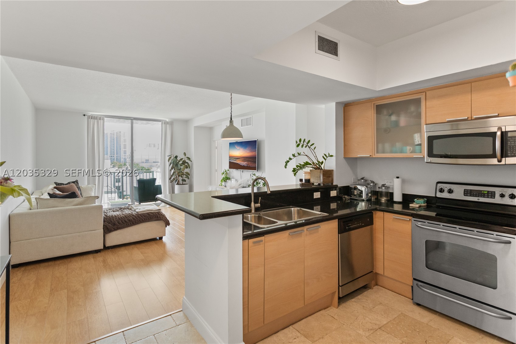 Special assessment already paid in full by seller — the only unit in the building without this added cost to the buyer.  
Enjoy the vibrant energy of Downtown Hollywood from this stunning 2-bedroom, 2-bath residence, which offers a refined blend of style and ease. Sweeping skyline views set the backdrop for a bright, open-concept layout with warm, wood-style flooring throughout. The primary suite features a dramatic floor-to-ceiling window, bathed in natural light and complemented by generously sized closets. Impact-rated windows throughout provide both hurricane protection and exceptional sound insulation, creating a remarkably quiet, serene living environment despite the vibrant downtown setting. In-unit washer/dryer and covered parking add everyday convenience. A standout for convenience: this residence sits on the same floor as the building's gym and pool, putting both just steps from your door.
Hollywood Station offers 24-hour concierge, valet, a fitness center, pool, clubhouse, and billiards lounge. Pet-friendly, up to 2 dogs at 35 lbs each. A rare opportunity in the heart of downtown Hollywood. Just steps from Hollywood Boulevard's restaurants and nightlife, and walkable to Young Circle/ArtsPark for concerts and events, with the area's best beaches a short drive away. 15 min to Airport.
The association has reserves. Whether you're buying for yourself or as an investment, this is a great option. Schedule your private showing today.
