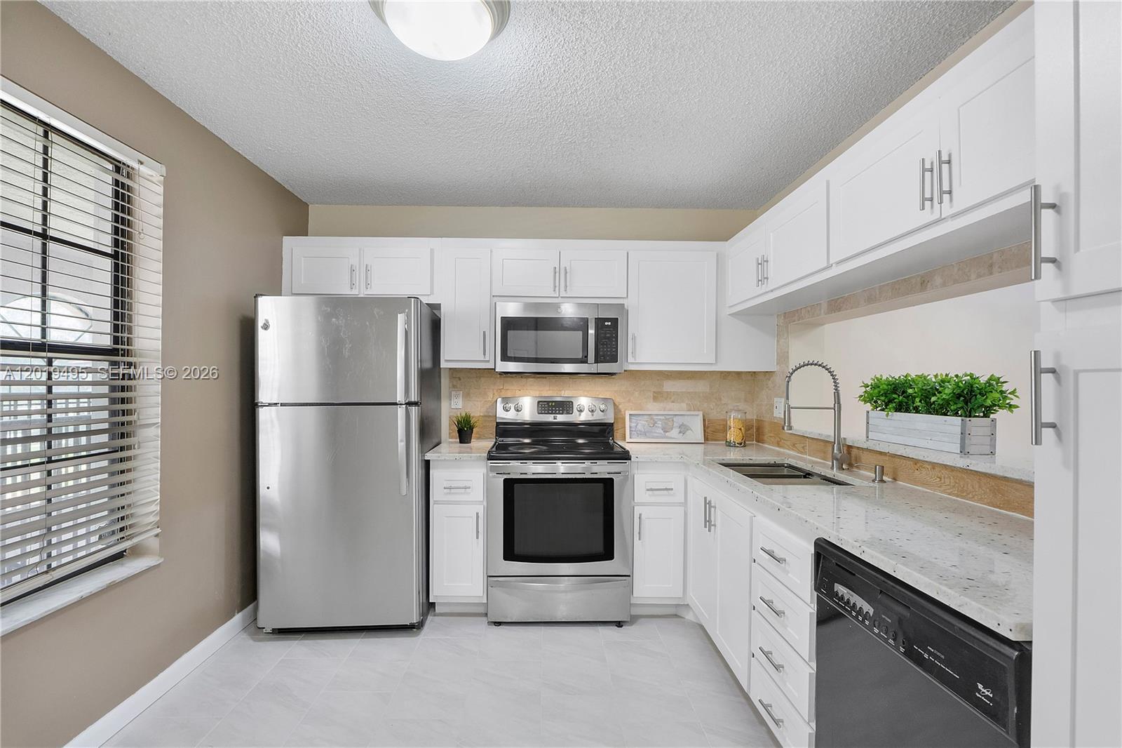 Beautifully remodeled 2-bedroom, 2-bath split bedroom corner unit condo in the heart of Coral Springs! This move-in ready home features a freshly painted interior, remodeled kitchen with new cabinets, granite countertops, and tile and carpet flooring, upgraded bathrooms with new vanities, sinks, and faucets. Private screened-in patio with storage, brand-new hurricane front door, 2025 AC, and newer hot water heater. Enjoy assigned parking directly in front of the unit plus plenty of guest parking nearby. Association covers building insurance, water, sewer, maintenance, and community pool access. Conveniently located near top-rated schools, shopping, dining, and malls.