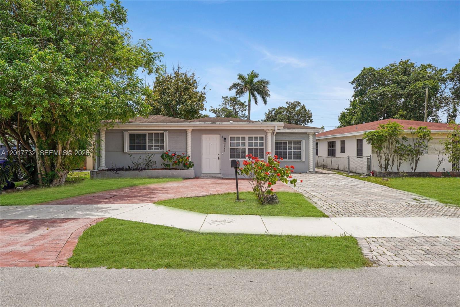 Spacious single-family home featuring 5 bedrooms and 2 bathrooms on a 7,010 sq ft lot. This property offers laminate and carpet flooring, ceiling fans throughout, and a circular driveway with plenty of parking. Enjoy outdoor living with both an adult pool and a separate kiddie pool, complete with a child safety fence for added peace of mind. The open kitchen is equipped with stainless steel appliances and flows into large living areas with plenty of space for entertaining and everyday living. Conveniently located near Young Circle, the Hollywood Beach Golf Club, dining, shopping, and just minutes from I-95 Expressway. Hollywood Beach is only 15 minutes away.