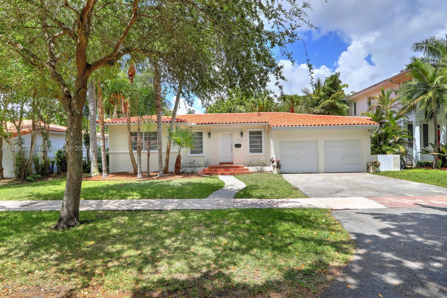 This charming one-story home is ideally located on the beautiful, tree-lined, San Vicente Street. 2B/2B, 1673 adjusted sqft, spacious family room, gleaming hardwood floors, updated kitchen with stainless-steel appliances, granite countertops and adjacent breakfast area. Oversized two-car garage with ample storage loft. Open patio overlooking fenced backyard and lush greenery. Fresh exterior paint, new A/C ducts & vents.