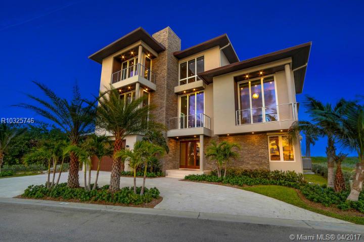 Enter the gates of Diamond Sands where this 4 bedroom 4.5 bath + office oceanfront home awaits. You will be captivated by the PANORAMIC East to West Views of the Ocean & the Indian River Lagoon which makes this address a place of prominence & seclusion. Once inside you will experience this magnificent Classic decor meets modern design, accompanied by all you desire. Fully Furnished with Designer touches , Floating Staircase with glass Railings & 6 Seat Cinema Room with Audio system & Projector Screen, cust