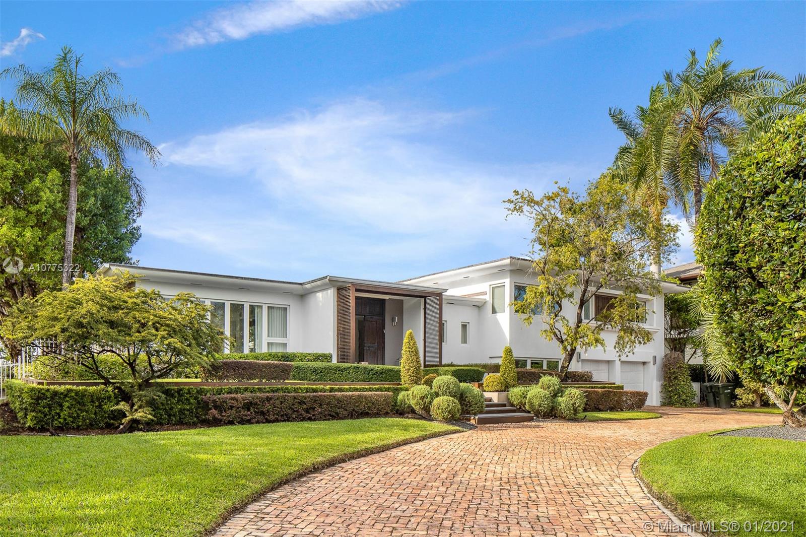 This magnificent MiMo style waterfront home in Bay Harbor enjoys the same views as those of $20mil + homes.  Renovated with curb appeal and dramatic Western exposure. This open, split plan with wood and white glass flooring throughout is perfect for hosting. The master suite is perched right above the water and the dual master bath is spacious and modern. A contemporary eat-in kitchen also faces the prized Western views. Situated on a 20,000SF lot on the premier part of the street with 112 FT on the Biscayne Bay, this is prime real estate. Outdoor entertaining is special with a sunken summer kitchen, lush landscaping throughout, and an oversized pool to enjoy all year round. Live minutes from Bal Harbour Shops and surrounded top schools. This can be your dream come true on the water!