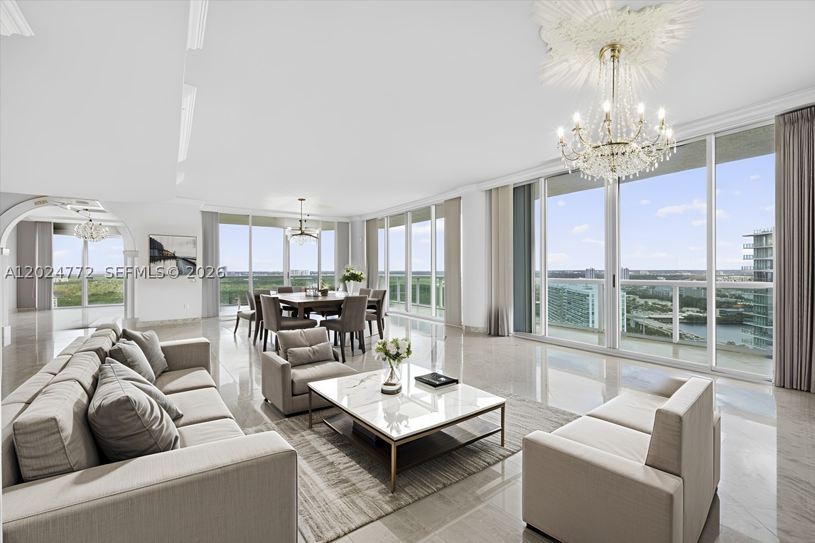 Welcome to Exclusive Sunny Isles Beach's Finest Towersuite Extraordinaire. Artisans & Craftsmen Have Completed A Work Of Art with Finest Finishes. Upgrades & Features Include 10 Ft Ceilings, All Marble Floors Throughout, Super Spacious 4 Bed + Den or 5th Bedroom + Family Room, Custom Lighting, Custom Doors, Custom Closets, Etch Glass, Archway's, Electric Window Treatments, Subzero, Wine Cellar, and So Much More, 2 Large Terraces With The Most Panoramic Ocean, Bay & City Views. Enjoy the unsurpassed lifestyle of Oceania with tennis courts, clubhouse, beach service, best restaurants indoors and outdoors, spa, sauna, fully equipped gym with Zumba classes, happy hours, and 5 star luxury resort amenities . A boater's dream on private island with a marina and so much more.