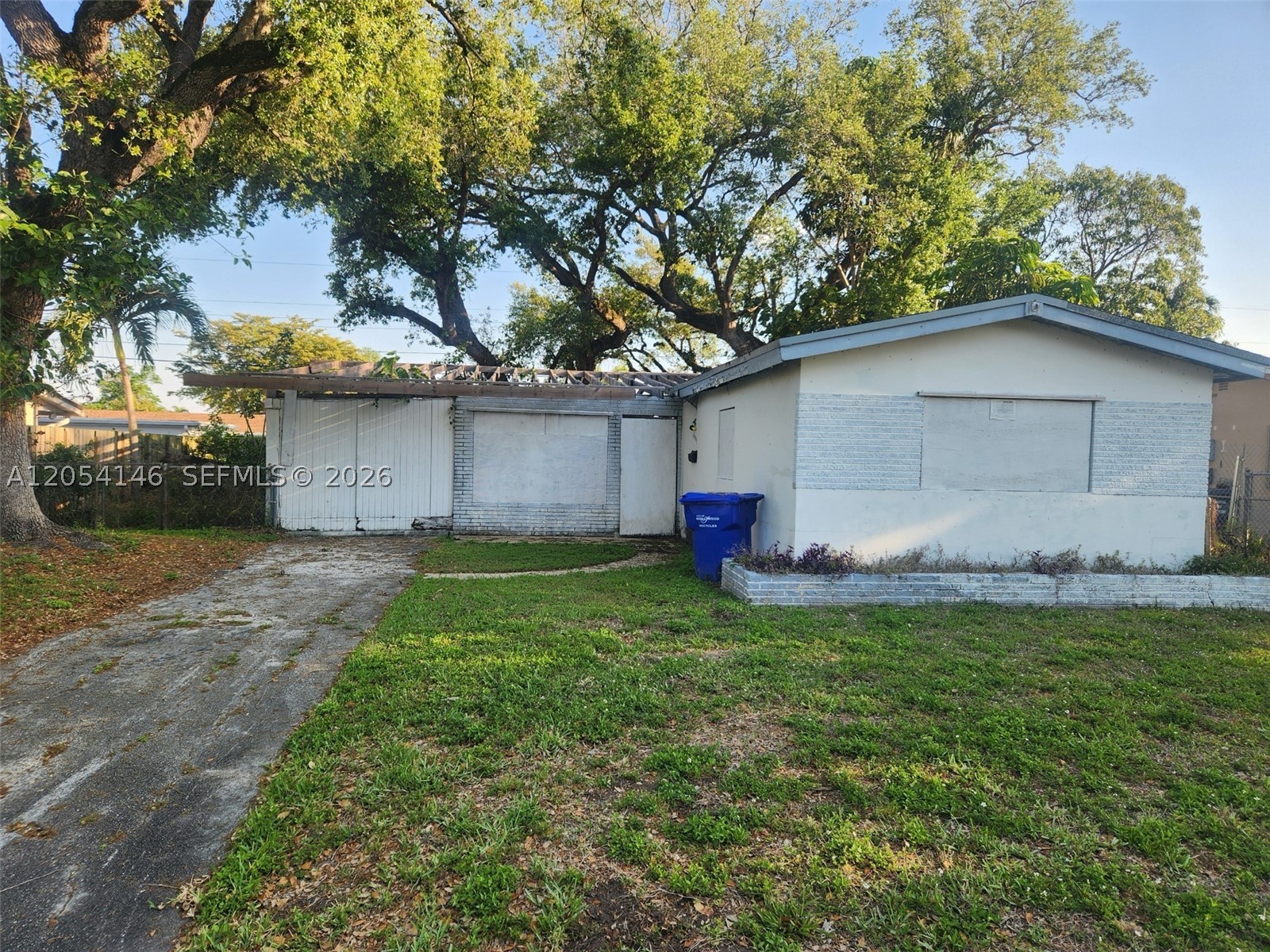 Located in a quiet, established neighborhood in Hollywood, this property offers convenient access to the Hard Rock, Florida Turnpike, and nearby shopping and entertainment. The fenced backyard features mature oak trees that create a beautiful natural canopy.
The existing structure provides a solid footprint with significant potential for renovation. The property requires full rehabilitation and is suited for cash buyers or hard money financing only.
Please do not walk the property without a scheduled appointment.