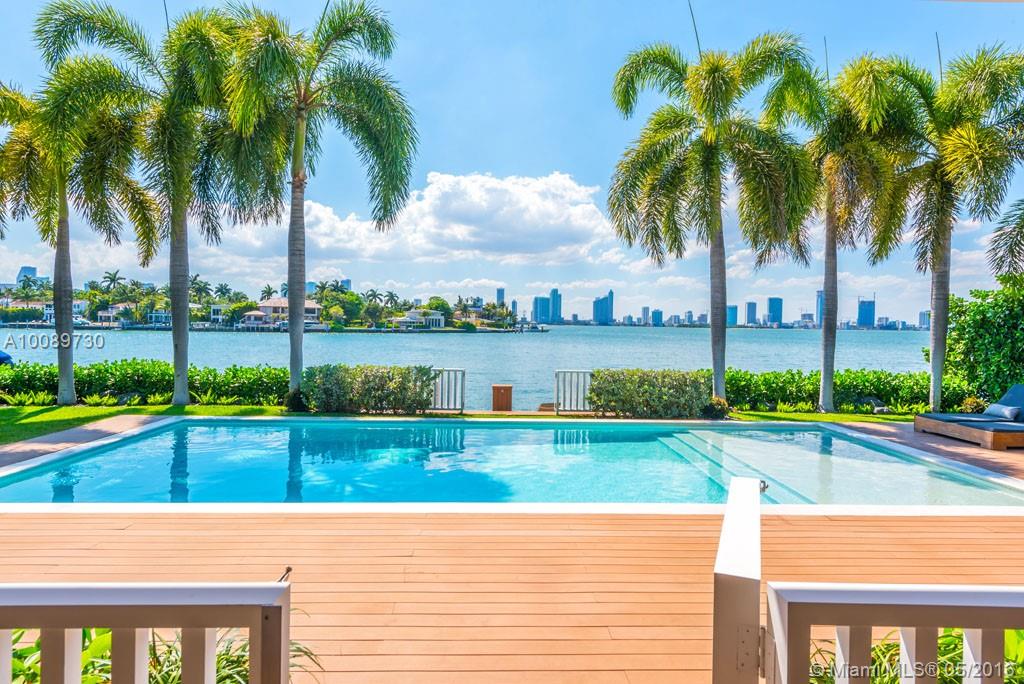 Stunning modern newly renovated 5 bed, 5 1/2 bath home with tropical design influence on Venetian Islands with tranquil westerly views of Biscayne Bay. Serene courtyard entrance and Ipe details surrounding the home. Gourmet kitchen, top of the line finishings, wood floors in living areas, open plan family and dining. Large covered exterior entertainment patio with poolside BBQ. A "smart home" for luxury living. 80 feet on water with west sunset views.