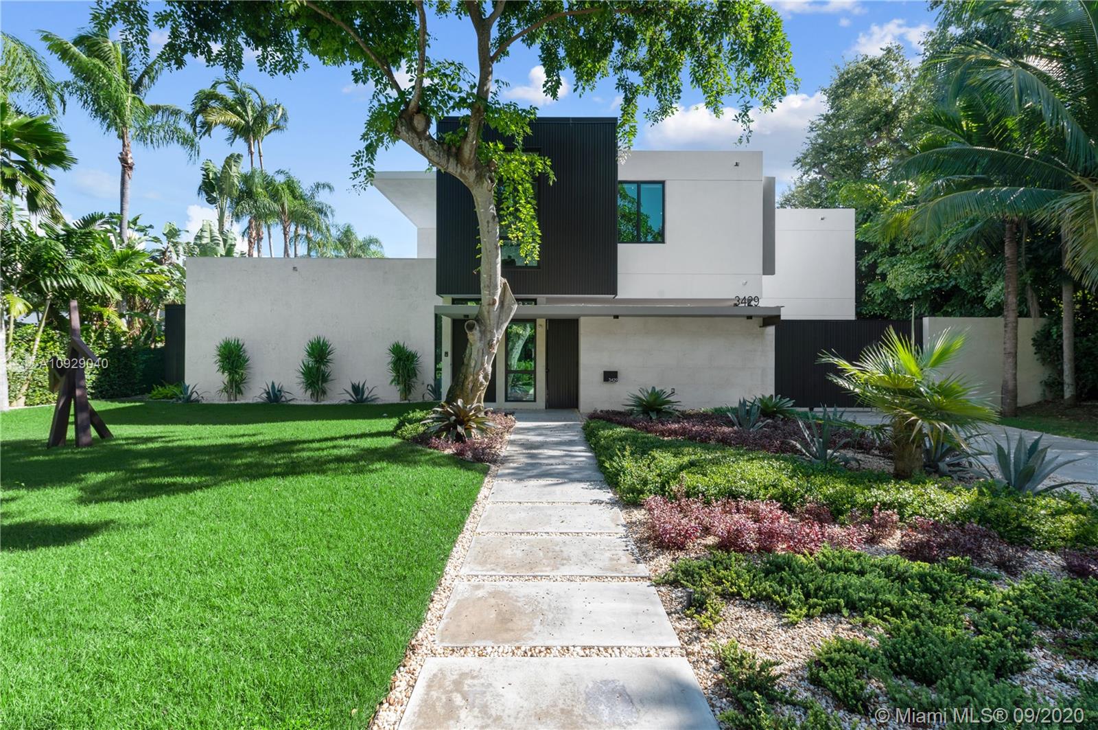Heavenly Moorings haven designed by Roney Mateu in the Modern Miami style is thoughtfully conceived & exquisitely executed. All-new construction offers effortless 21st-century luxury living & timeless sensibility. Understated elegance reigns. Every inch of its “just-right” 5,936 SF is scaled to full advantage. Sky-high glass walls welcome natural light & frame the lush landscape & 63-ft pool w/waterfall. Marble graces flr 1, oak plank flr 2. Ultimate Scavolini Italian kitchen w/Gaggenau appliances; sleek baths; full gym; staff suite.+Optional boat slip! The private, gated Moorings enclave boasts 24-hr security & 3 parks within its intimate bayfront confines; from its coveted Main Hwy address walk or bike to top-tier schools, downtown Grove restaurants & shops. Absolutely fabulous/flawless.