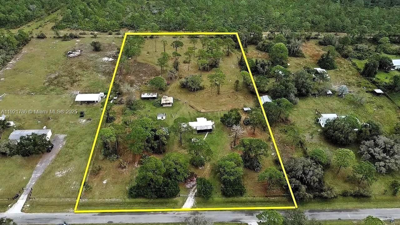 YOUR OWN 5-ACRE FARM 10 MIN FROM OKEECHOBEE! Fully fenced 4.89-acre property with a renovated 2BR/1.5BA manufactured home featuring new vinyl floors, updated kitchen with full appliance package, central A/C, and a screened porch. The land is divided into multiple pastures ready for horses, cattle, or agriculture. Includes outbuildings for equipment storage, workshops, and animal housing. Well water and septic already in place. Paved road access. NO HOA total freedom to build, farm, and expand. Den/office could serve as a 3rd bedroom. Fruit trees on property. Only $2,772/yr in taxes! Schedule your private tour today.