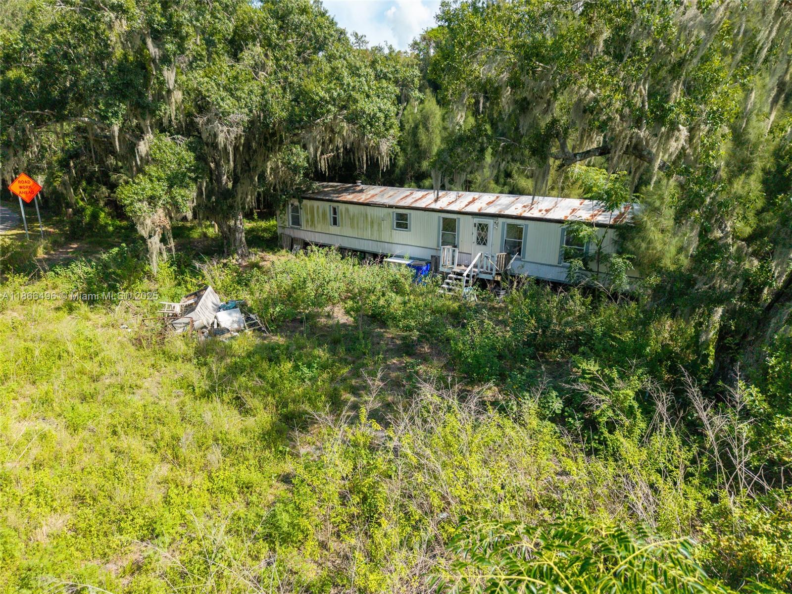 Prime 20 acres bordered by US HWY 98 and Lake Istokpoga Park at $45,000 an acre. On site is a mobile home that needs rehab but has good electric and septic. US 98 is the main road connecting Sebring area to the coast and Lake Istokpoga Park is a county maintained park on the 27,000 acre muck-bottomed lake offering fishing/boating, bathrooms, grills, picnic areas, small nature walk trails, and boat ramp. The property is about 15 minutes to Publix, 10 minutes to the track at Sebring International Raceway, 10 minutes to Sebring Regional Airport, golfing nearby in Spring Lake, down the road from popular restaurant Gator Shack. The location allows for the possibility of a private owner who would like to work the land again, a developer, or an agri-tourism business. MOBILE HOME NEEDS WORK