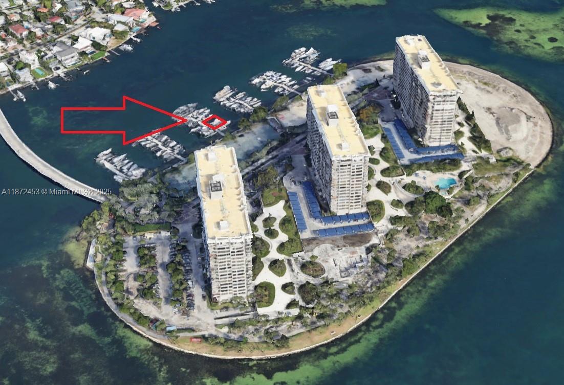 Rarely available dock slip, C-13, with new lift at Grove Isle Marina. 56,000LBS new Golden boat lift. Max 53 foot boat. $2824 quarterly marina maintenance fee. Customizable bunks for any boat shape or size including monohulls and catamarans. 24 hour security, daily dock hands, dock carts and marina amenities. Call LA.