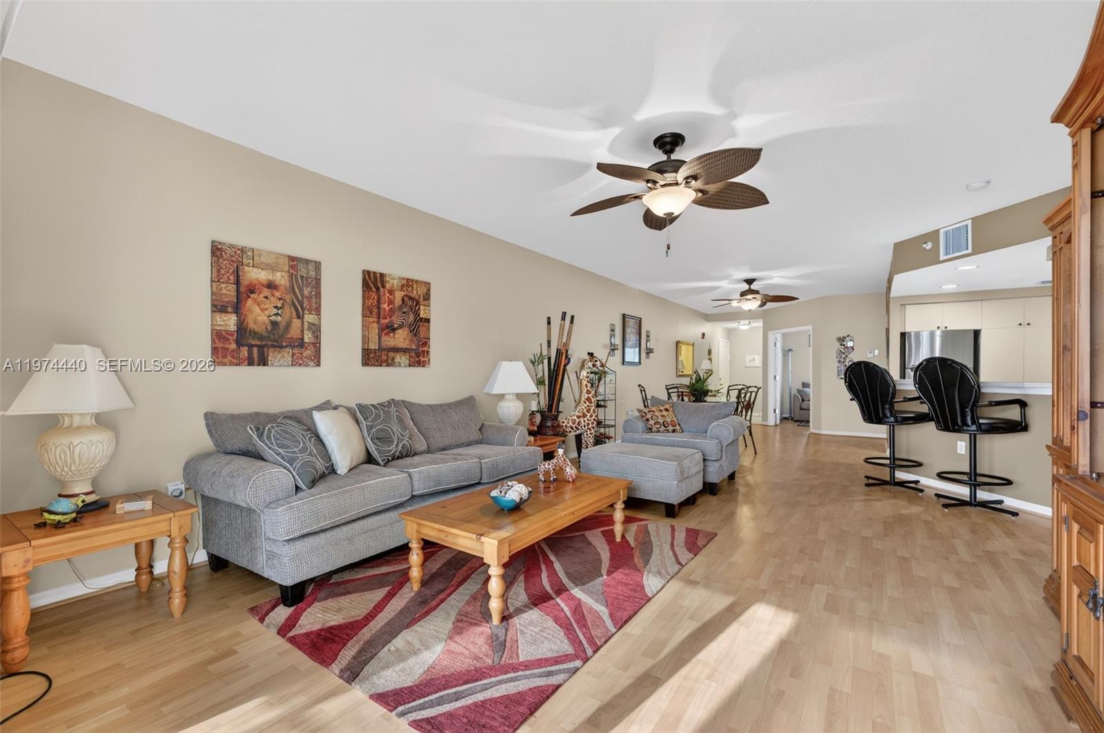 Beautiful and spacious 3-bedroom condo in Deerfield Beach featuring serene lake views and a screened balcony. This fully furnished residence is truly move-in ready and offers a bright, open layout with wood-look laminate and tile flooring throughout the main living areas. Generous living and dining spaces create a comfortable flow for everyday living. Washer and dryer conveniently located inside the unit. Well-maintained and in great condition. Enjoy peaceful waterfront views in a centrally located community close to shopping, dining, and major highways. Easy South Florida living at its best!