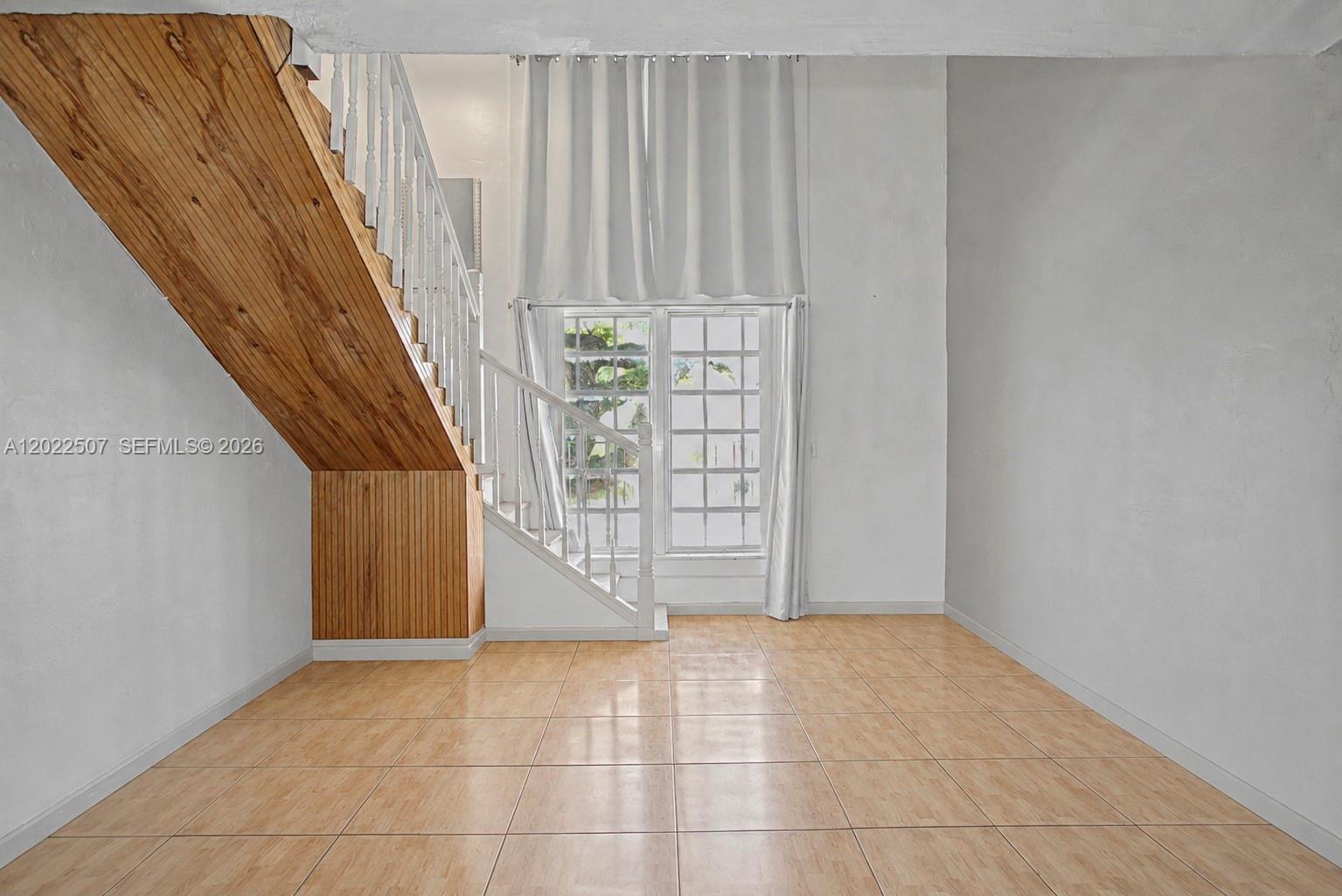 Opportunity knocks in the heart of Kendall! Ideally located near major highways, shopping, dining, and just minutes from Miami Dade College, this multi-level 1-bedroom, 1.5-bath condo offers incredible potential for investors or buyers looking to create their own vision.

The unique split-level layout gives the home a much larger and more expansive feel, featuring soaring ceilings in the living area and a large oversized window that fills the space with natural light. Downstairs includes the kitchen, living room, and convenient half bath, while upstairs offers a private primary suite complete with a spacious walk-in closet and full bathroom.

This an exceptional opportunity to renovate and add value in a highly desirable Miami location.