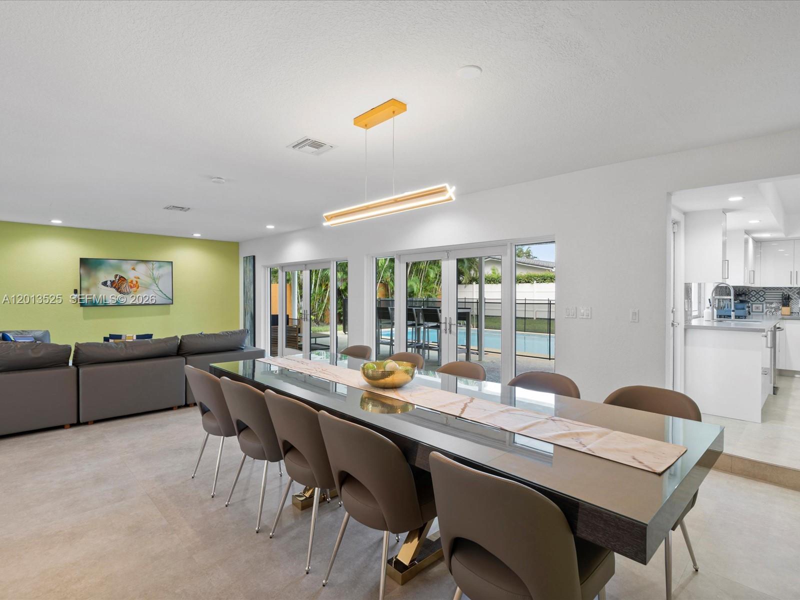Discover a fully renovated one-story luxury home offering a rare combination of space, functionality, and location. This move-in ready residence features 5 legal bedrooms (garage excluded) and 2 beautifully updated bathrooms, along with a bright, open-concept living and dining area designed for modern living. Expansive windows fill the home with natural light, highlighting the clean finishes and thoughtful layout throughout.
Enjoy added peace of mind with a 2018 roof and partial impact windows, enhancing both durability and efficiency. The flexible floor plan provides the opportunity to easily add a third bathroom, increasing convenience and long-term value.
Step outside to your private backyard retreat, complete with a sparkling pool—ideal for entertaining or relaxing in complete privacy.
Perfectly situated near top dining, shopping, major roadways, and within walking distance to houses of worship, this home delivers a rare blend of location, lifestyle, and livability.