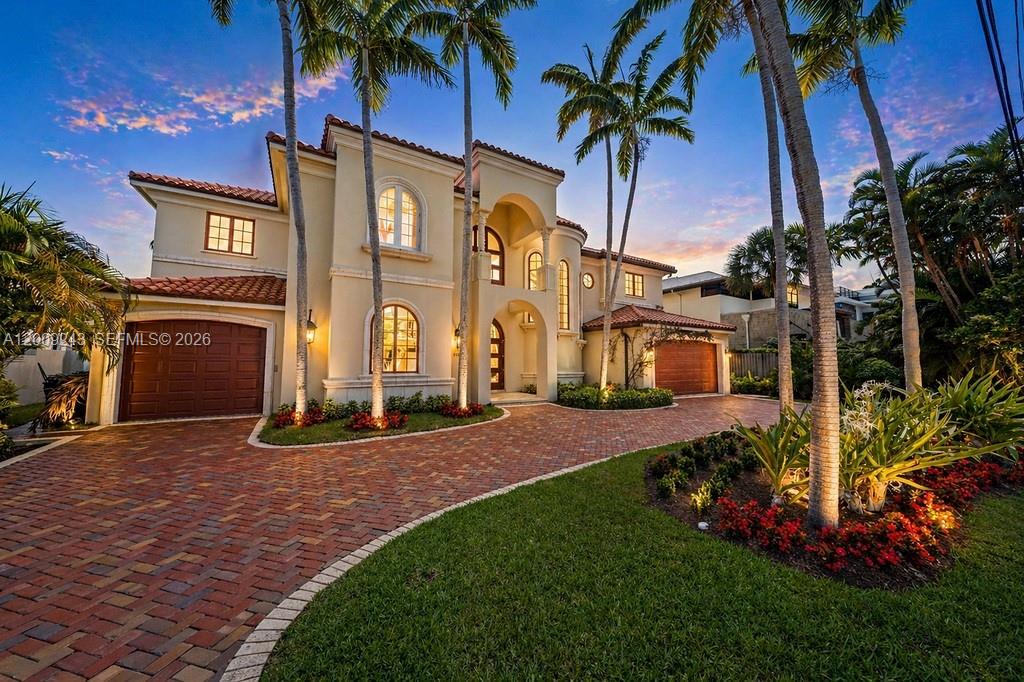 Exclusively positioned within the prestigious Seven Isles waterfront enclave, this exceptional deep-water estate captures the essence of Fort Lauderdale’s most refined boating lifestyle, just moments from Las Olas Boulevard and within walking distance to the beach. With 90 feet of prime dockage, direct ocean access, and no fixed bridges, it offers seamless passage for larger vessels and effortless access to open water. A dramatic two-story great room, anchored by a statement fireplace and walls of glass, creates a striking yet inviting ambiance, filled with natural light and designed for seamless indoor-outdoor living. The residence features five bedrooms, six full & 1 half bath, along with a media room and game room, thoughtfully curated for both intimate living and sophisticated entertaining. At the heart of the home, the kitchen flows gracefully into the main living spaces and extends to a covered terrace, where a resort-style pool and elegant lounge areas overlook the Intracoastal, offering a private backdrop of water and sky. Seven Isles is among Fort Lauderdale’s most coveted enclaves, prized for its privacy, premier location, and rare walkability to Las Olas and the beach, delivering a lifestyle defined by luxury, convenience, and coastal elegance.
