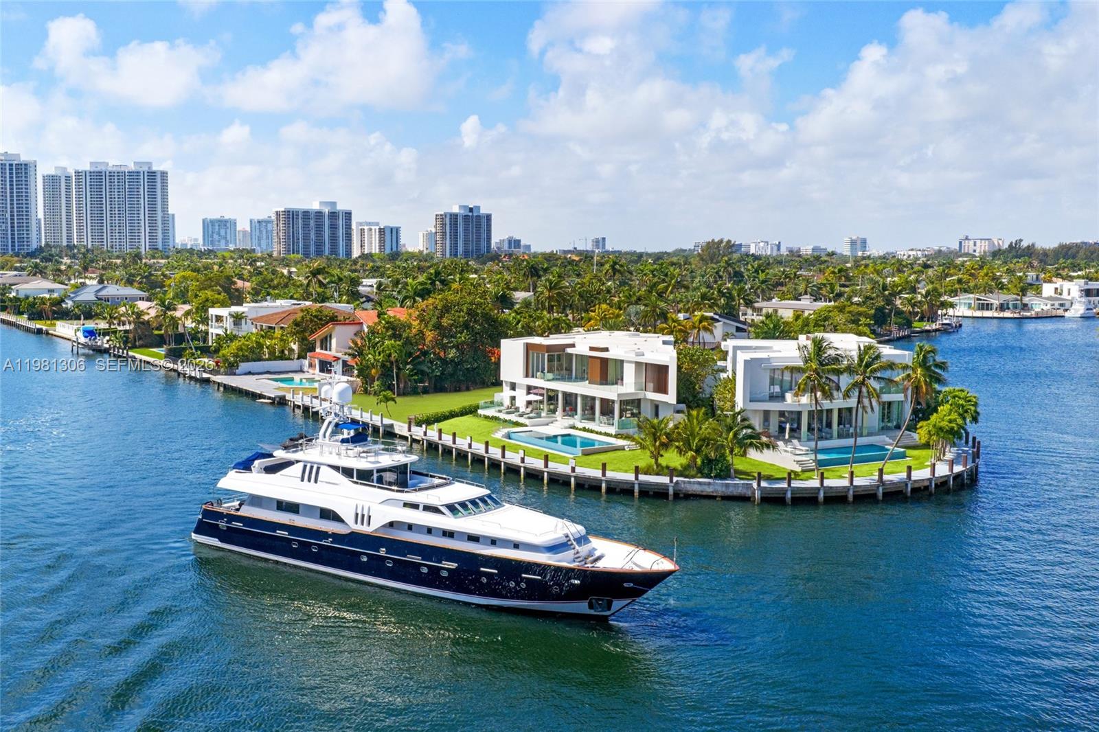 Now Completed!! Welcome to 503 Palm Drive, a spectacular brand new waterfront estate in the prestigious guard-gated community of Golden Isles in Hallandale Beach. Perfectly positioned on a 15,000 SF lot with 135 FT of prime direct Intracoastal frontage, this residence offers an exceptional 7,250 SF of luxurious living space. Crafted with exquisite Italian finishes throughout, the home features elegant porcelain flooring on the main level and rich oak wood floors upstairs. A private elevator seamlessly connects all levels. Offered fully furnished turnkey with curated designer pieces and fully built-out closets throughout, this home is truly move-in ready. The thoughtfully designed layout includes 7 spacious bedrooms, 7 bathrooms, a private VIP office, dedicated massage room and as spacious two-car garage with high ceilings suitable for a lift system. Step outside to a spectacular waterfront backyard featuring a resort-style pool, expansive lounge areas to relax and soak up the sun, and plenty of space for entertaining and outdoor enjoyment. A brand new concrete dock fully equipped for yacht enthusiasts completes this exceptional outdoor setting. Ideally located between Miami Beach and Fort Lauderdale, just minutes from Aventura Mall, Gulfstream Park, and top A-rated schools. This is the best value in South Florida, be the first to live in this brand new modern gem and enjoy front row seats to every boat in Miami