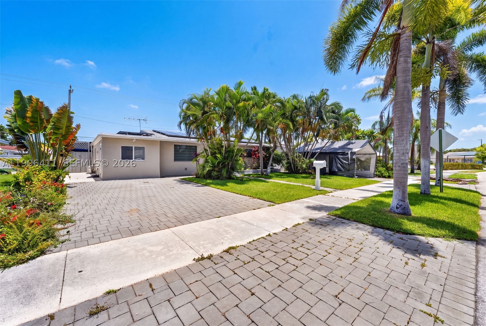 Enjoy a Slice of South Florida Paradise! Minutes to the Beach! Turnkey 3BR Home with spectacular pool backyard. This stunning three-bedroom, two-bathroom home is an absolute dream for entertainers, located just minutes from the beach. The completely turnkey interior boasts a fully updated kitchen, modernized bathrooms, and gorgeous updated flooring throughout. One bedroom is versatile and provides the perfect layout for a private mother-in-law suite or guest quarters. Outside, the property features a magnificent backyard complete with a sparkling pool, a beautifully designed bar area for hosting unforgettable gatherings. Off on one side (behind a fence) is a paved area while also featuring ample storage cabinets.  Home features hurricane impact windows & doors and is equipped with high-end solar panels to drastically lower your electric bills.  This residence perfectly blends coastal proximity, modern eco-friendly efficiency, and flexible living spaces.  Home is one of a kind in the area, come see it today!