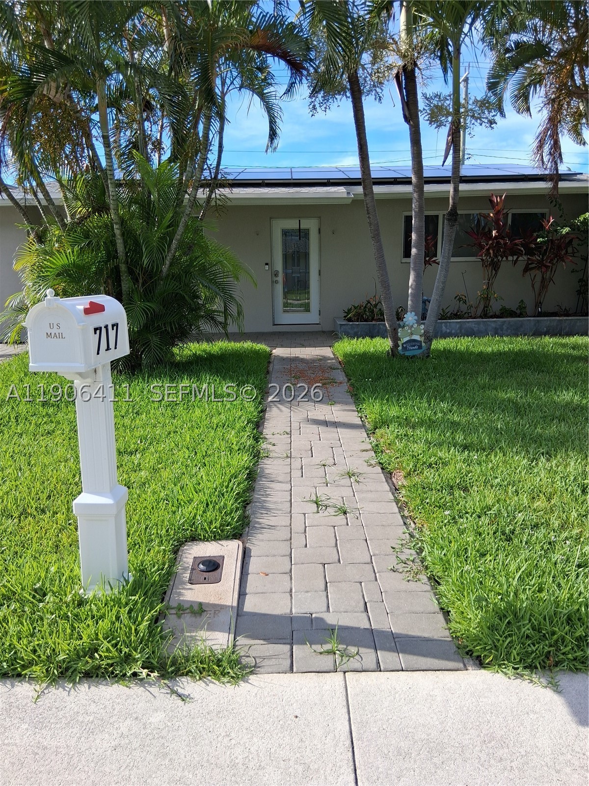 Enjoy a Slice of South Florida Paradise! Minutes to the Beach! Turnkey 3BR Home with spectacular pool backyard. This stunning three-bedroom, two-bathroom home is an absolute dream for entertainers, located just minutes from the beach. The completely turnkey interior boasts a fully updated kitchen, modernized bathrooms, and gorgeous updated flooring throughout. One bedroom is versatile and provides the perfect layout for a private mother-in-law suite or guest quarters. Outside, the property features a magnificent backyard complete with a sparkling pool, a beautifully designed bar area for hosting unforgettable gatherings. Off on one side (behind a fence) is a paved area while also featuring ample storage cabinets.  Home features hurricane impact windows & doors and is equipped with high-end solar panels to drastically lower your electric bills.  This residence perfectly blends coastal proximity, modern eco-friendly efficiency, and flexible living spaces.  Home is one of a kind in the area, come see it today!