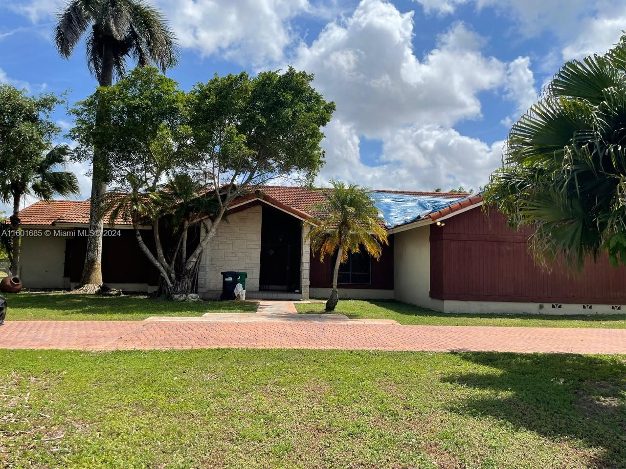 Investor special located in the heart of Redlands, just 1 block from Knaus Berry Farm. This property is a cash-only deal, ready for you to renovate & make your own. With 3,986 SQFT of total area & 3,052 SQFT of living area, this custom-built home features 4 bedrooms, 2.5 bathrooms, & sits on over 1 acre of land (45,738 SF lot). The property is completely fenced, includes a 2-car garage, high vaulted ceilings, a split bedroom floor plan, & spacious rooms throughout. Additional highlights include walk-in closets & a large kitchen with charming Florida pine walls. Located in the agricultural area of Miami but minutes from suburban Miami, this home offers an amazing location with immense potential. Priced to sell. Sold as-is, where-is. The roof needs to be replaced, this is handy man special.
