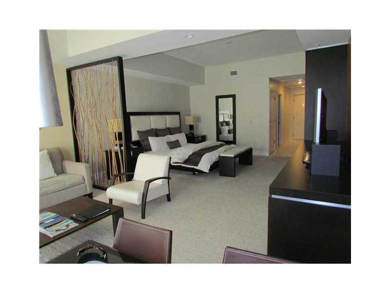 FORECLOSURE PRICE!!!!  Beautifully furnished and finished studio at Provident Doral at The Blue. Conveniently located across the street from Downtown Doral and Trump National Doral Golf Club, The Blue is also near malls, major highways, and airports.  Rig ht in the heart of Doral. Priced lower than any other unit in the building. Generate immediate income through on site rental program.