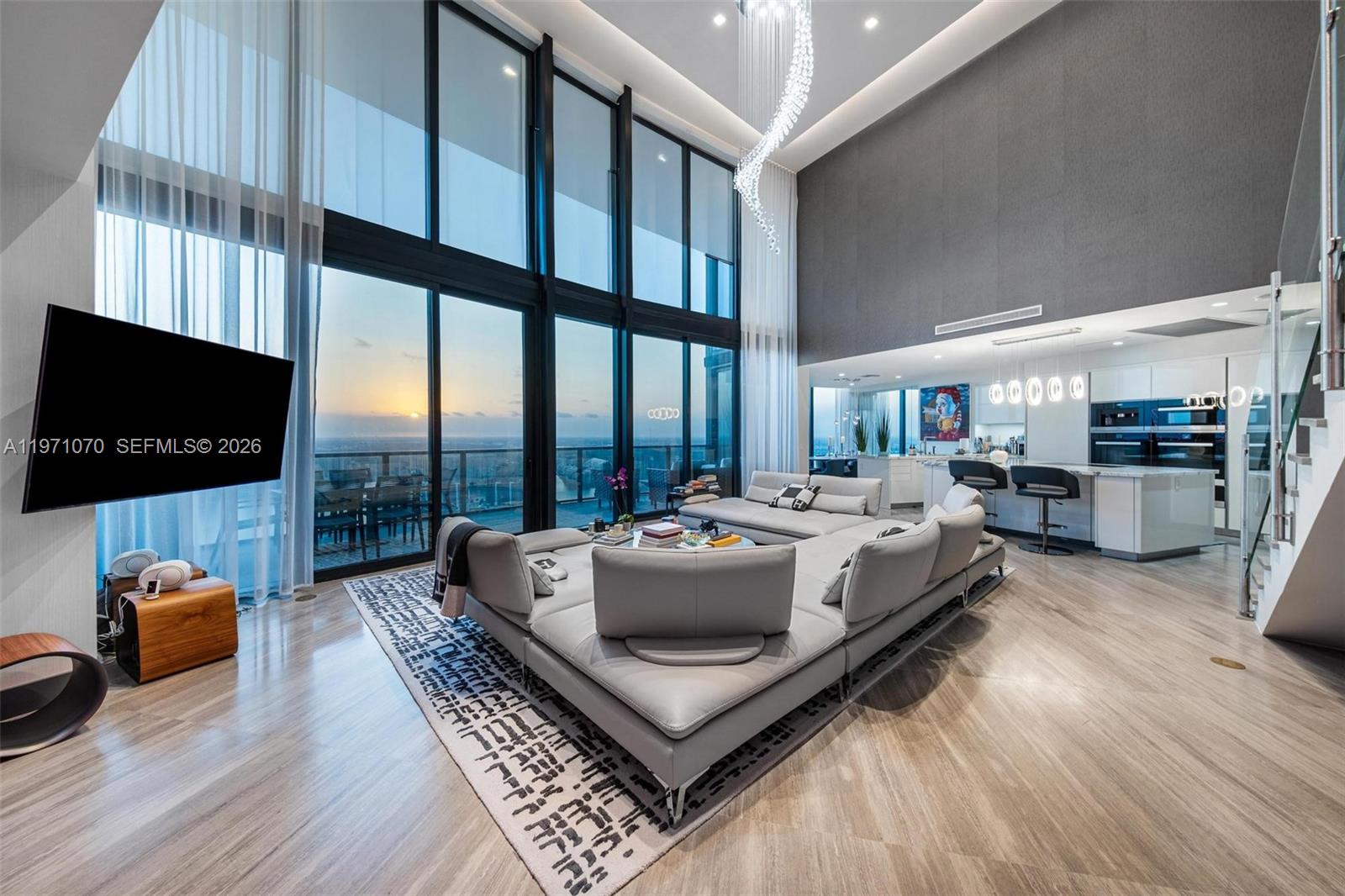 Experience elevated luxuries in this one of a kind Duplex in the sky, Residence 5003, boasting over 22ft ceilings soaring into the sky, this is a rare gem in which few are available, Meticulously finished, this turnkey 3 bedroom plus Den, 4.5 bathrooms home in the sky, has been designed with Roche Bobois, custom pieces, throughout the home, including Ornare costom  closets, wall finishes, and detailed lighting, all  in the Iconic Porsche Design Tower. This  sky residence has unparalleled views which never end, with expansive living room space & entertaining space, a secondary area perfect as a family room, the flow is like a custom home,  each bedroom features its own en-suite bathroom and custom closet. Private elevator entry and you have your own internal elevator which leads to the 2nd level with 22ft ceilings, floor-to-ceiling glass sweeping panoramic views Intracoastal, city, bay and downtown Miami skyline, includes and outdoor space with a gourmet kitchen. The signature car elevator delivers your vehicle directly to your private garage in the sky. Expansive terraces, a summer kitchen, seamless indoor-outdoor living. Enjoy a sleek open kitchen with Miele appliances and refined finishes, plus access to world-class amenities: restaurant, beach service, spa, car lounge, clubroom, yoga & fitness center, with white glove service from our onsite concierge.  Live your Dream today ! Miami at its best!