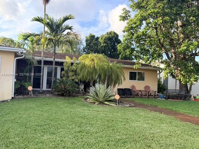 Spacious home in desired Hollywood Hills area!  This is an excellent location close to Hollywood Blvd. The house features a good size laundry room, converted garage could be media room, an office or whatever you desire, a large living room, nice outdoor patio, with screened POOL, a big back yard, updated impact windows. This house is easy to show and please contact the listing agent with any questions.